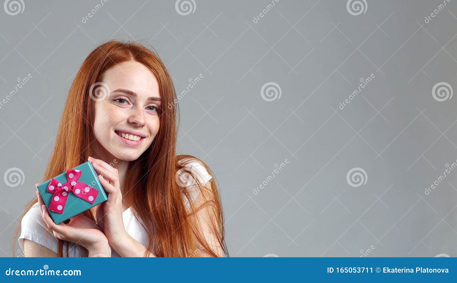 Portrait of an Attractive Redhead Young Woman Standing in Isolation ...