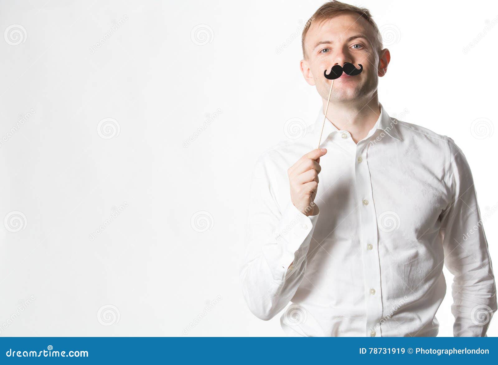 Portrait of an Attractive Young Man Wearing a Retro Style Fake Mustache ...