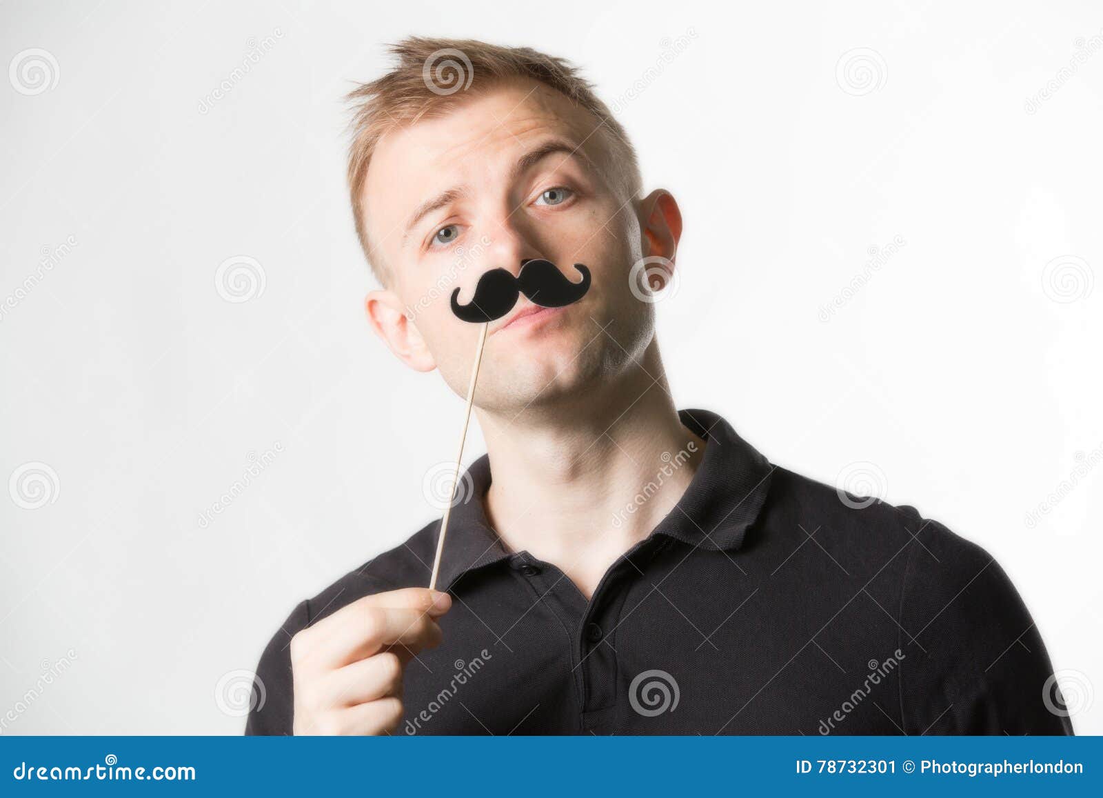 Portrait of an Attractive Young Man Wearing a Retro Style Fake Mustache ...