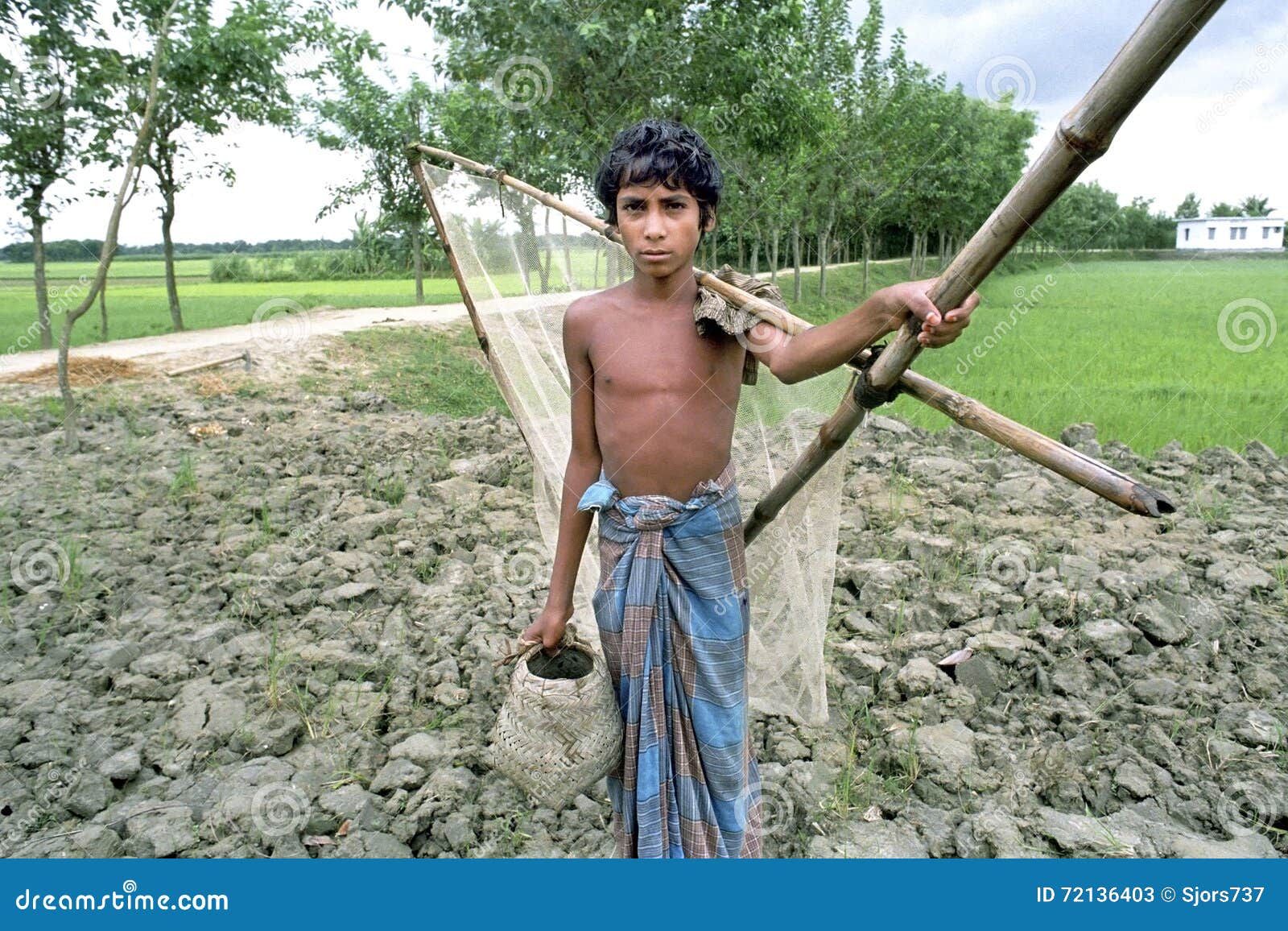 Portrait of Bangladeshi Boy with Fishing Gear Editorial Stock