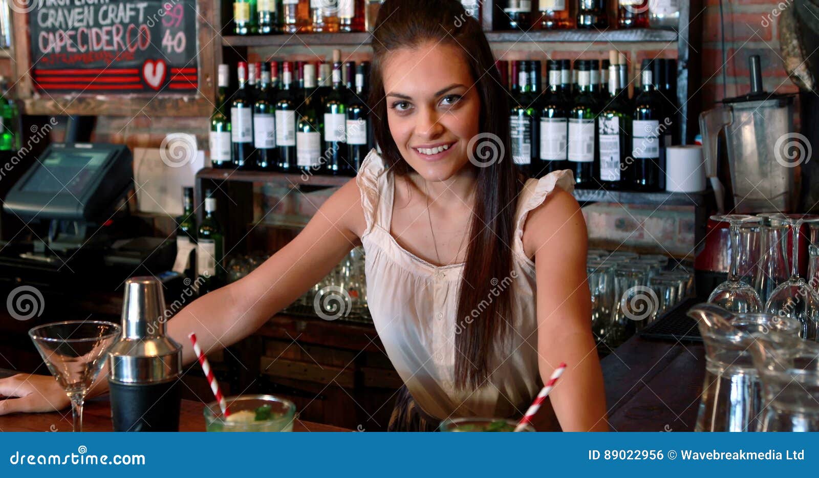 Portrait of Barmaid Serving Cocktail at Bar Counter Stock Footage