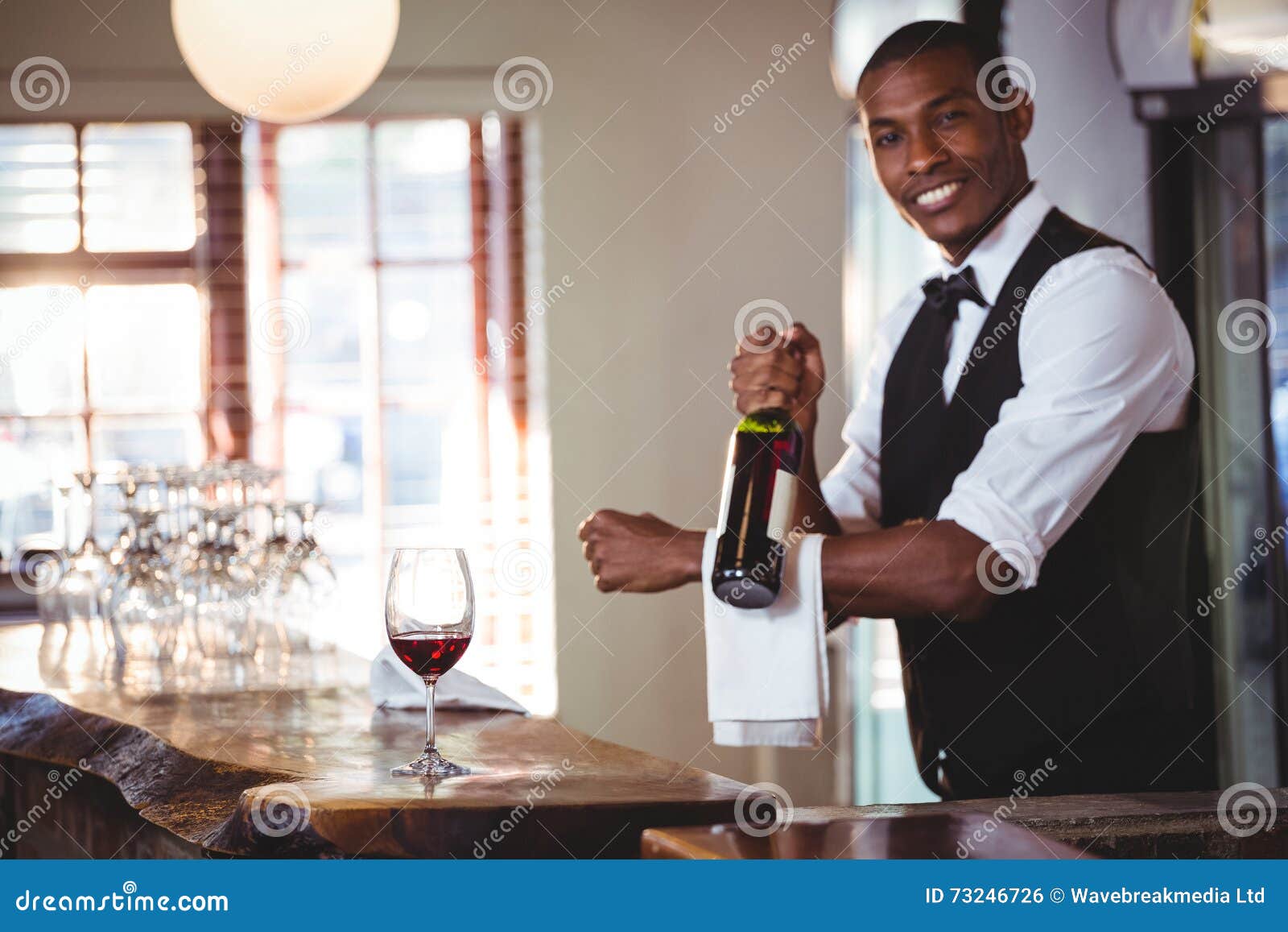 Portrait of Bartender Holding a Wine Bottle Stock Photo Image of