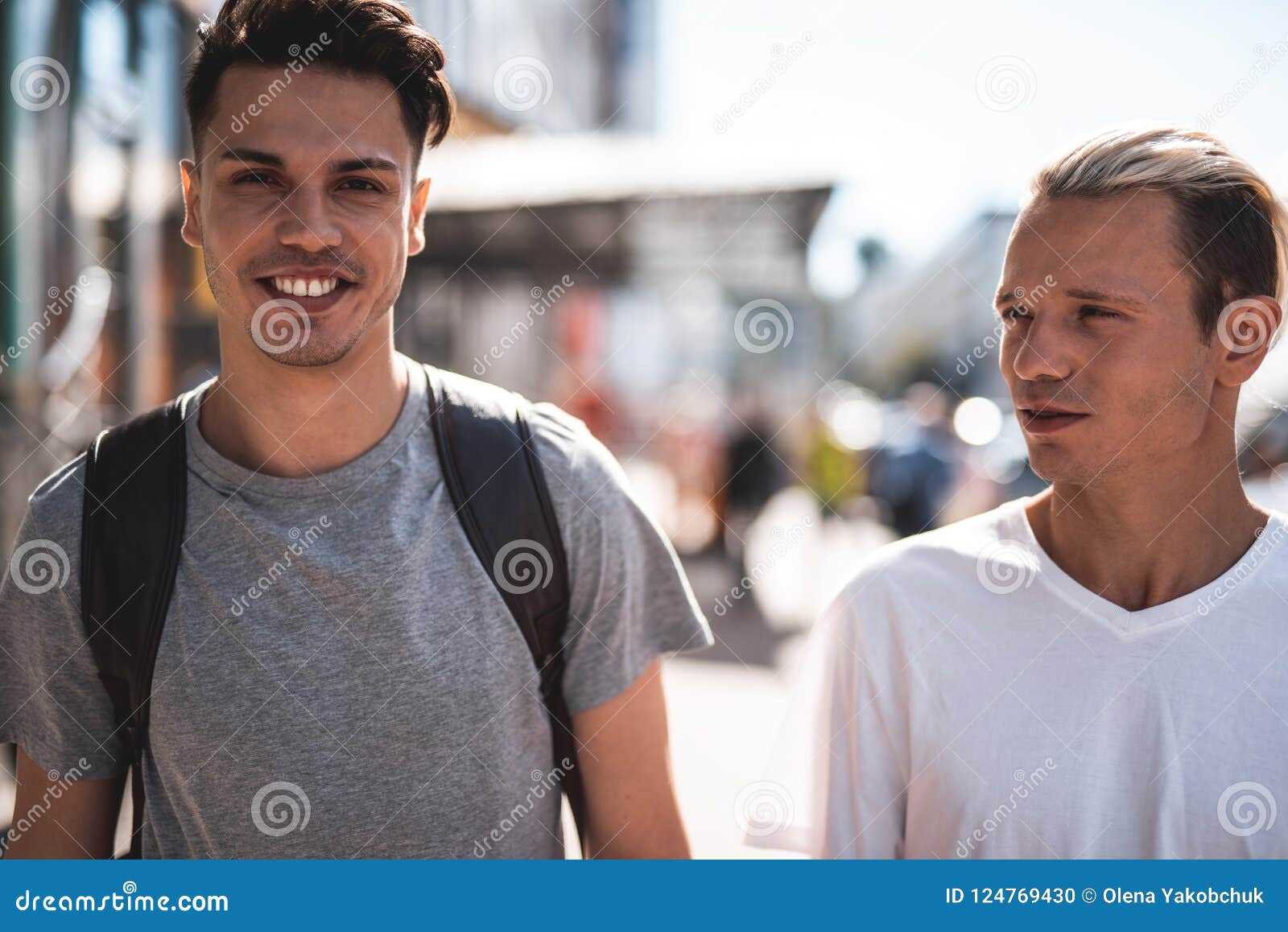 Optimistic Friends Speaking during Sunny Walk Outdoor Stock Photo ...