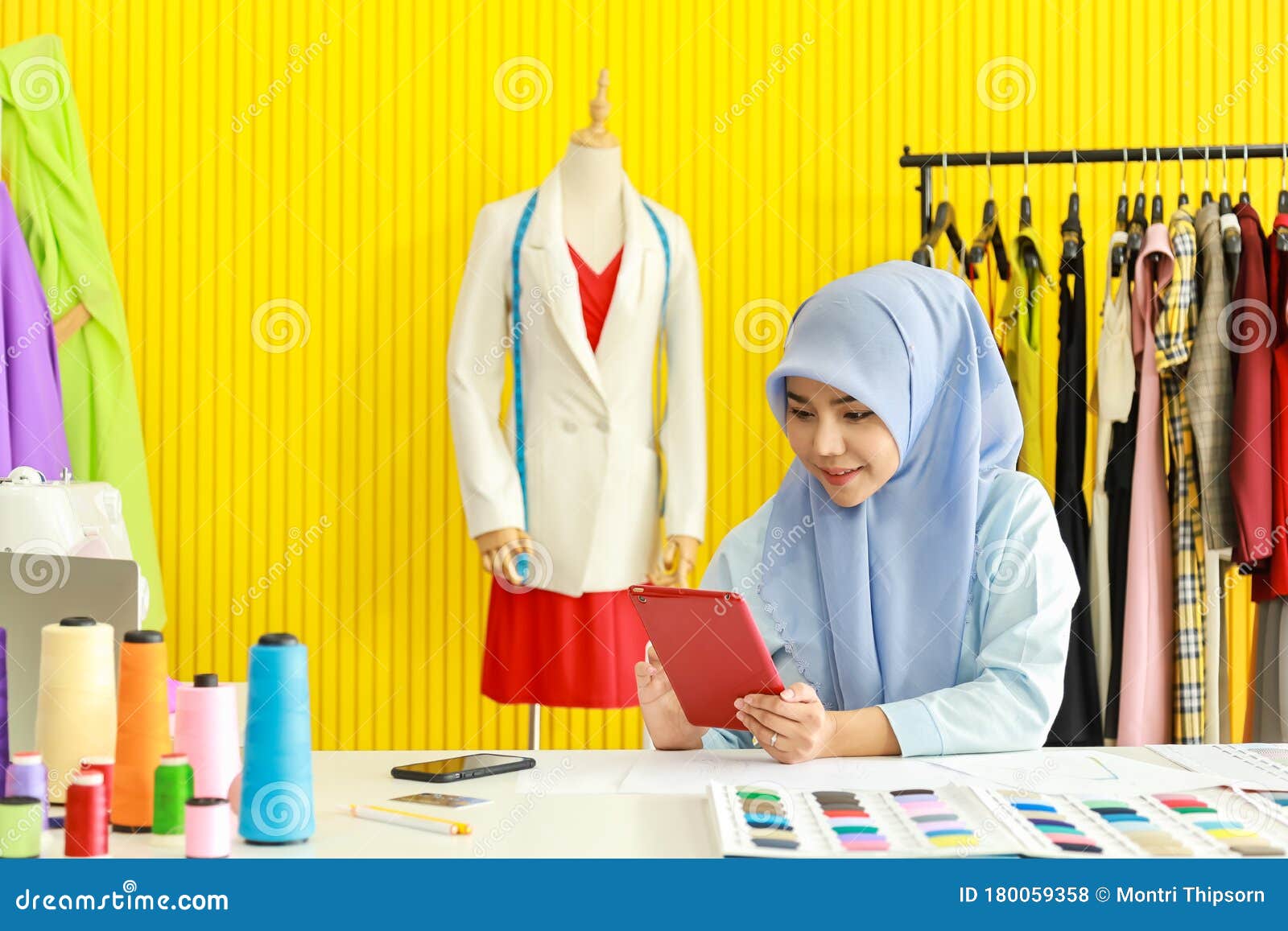 Download Portrait Of Beautiful Asian Muslim Woman Designer With Hijab Holding And Using Computer Tablet ...