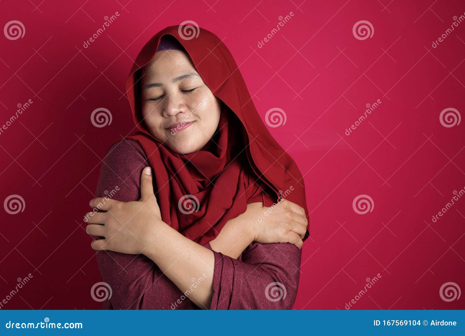 muslim woman hug her self