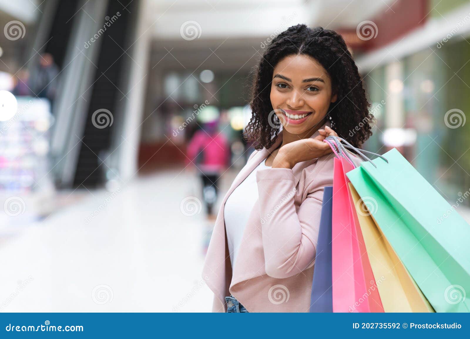 Portrait of Beautiful Black Woman Posing with Shopping Bags in ...