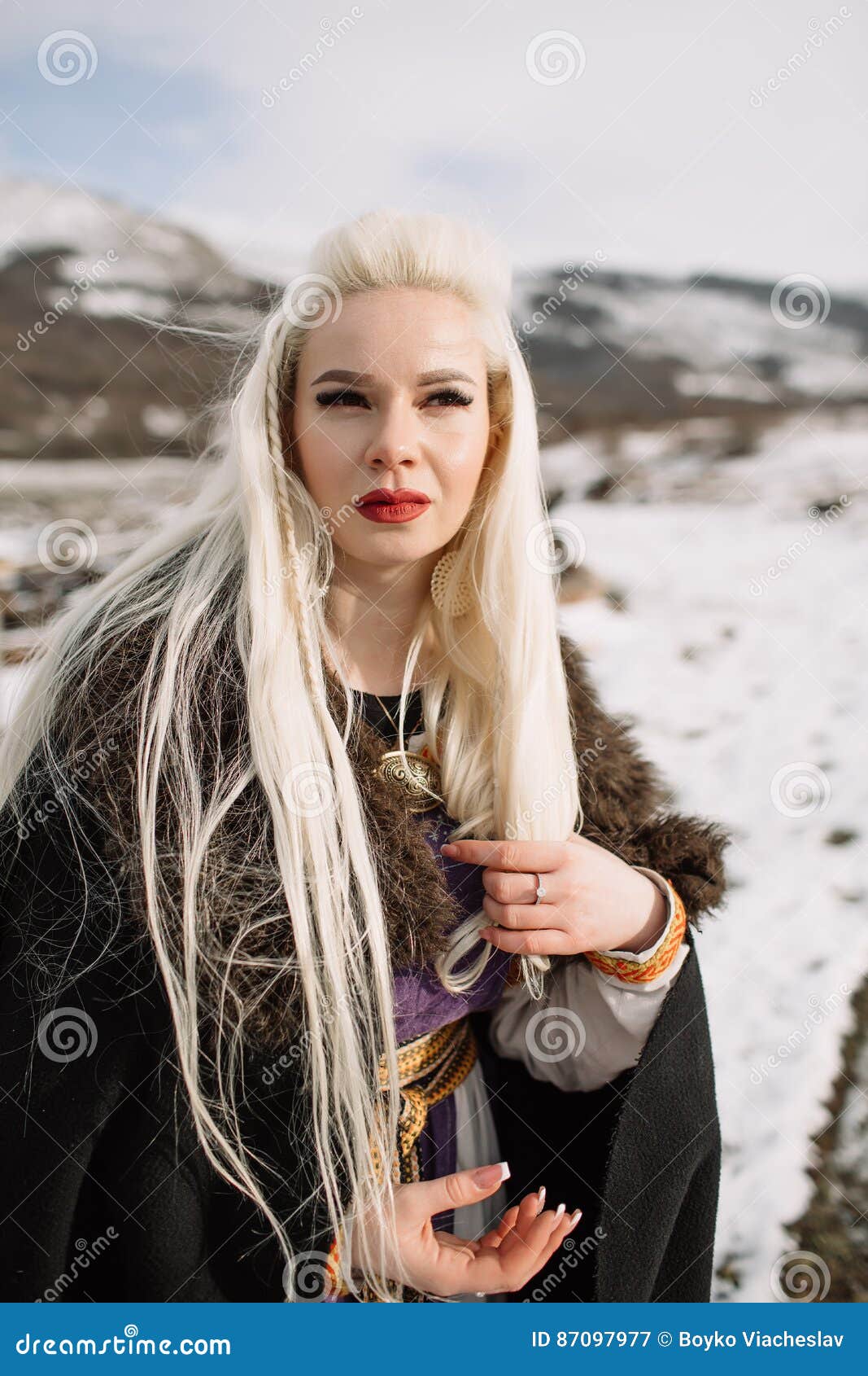 Portrait of a Beautiful Blonde in a Black Cape, Viking Stock Image ...