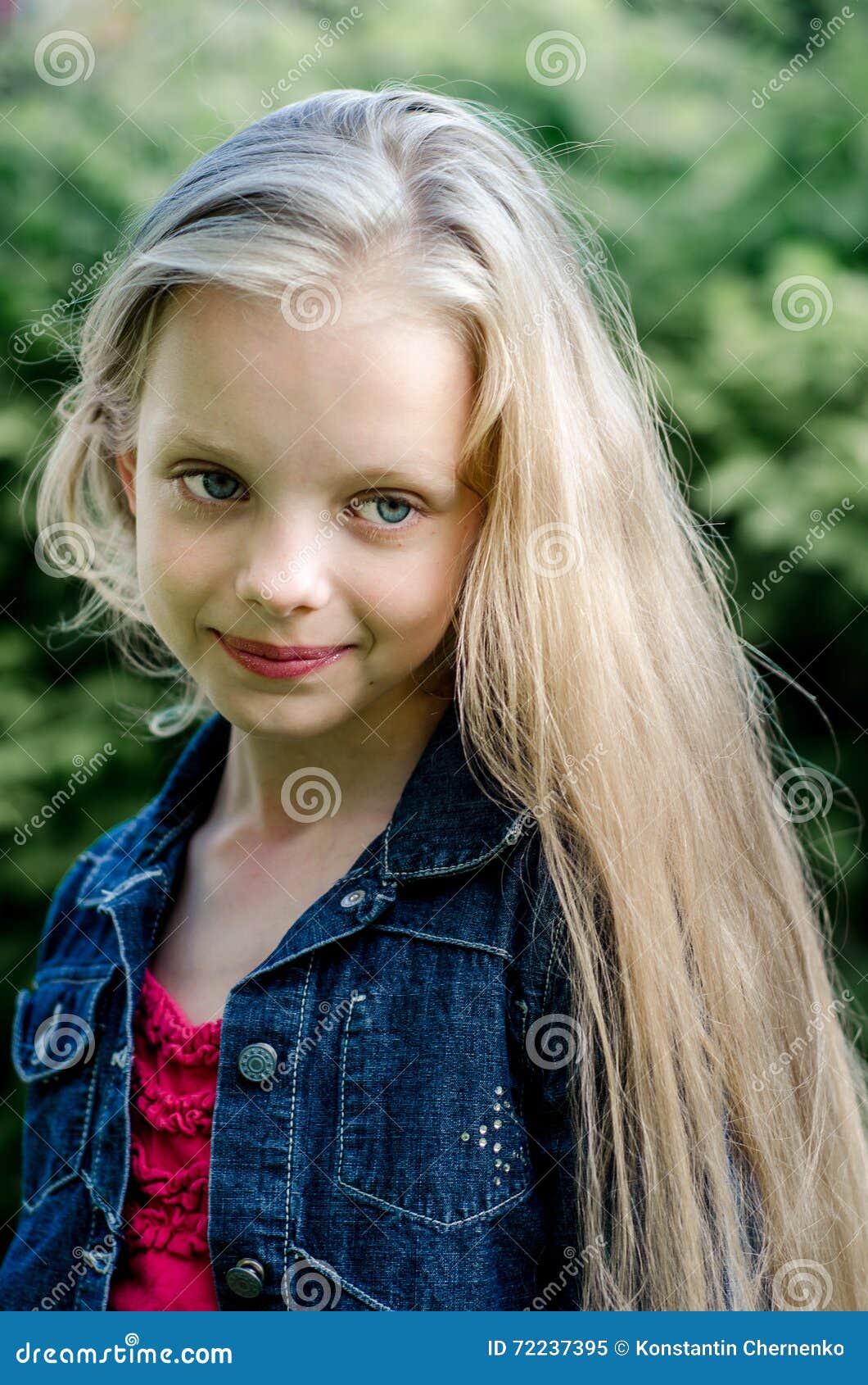 Portrait Of A Beautiful Blonde Little Girl With Long Hair 