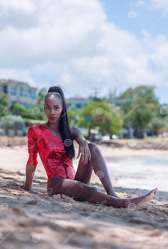 Portrait Of Beautiful Caribbean Adult Teen In Barbados Wearing Red