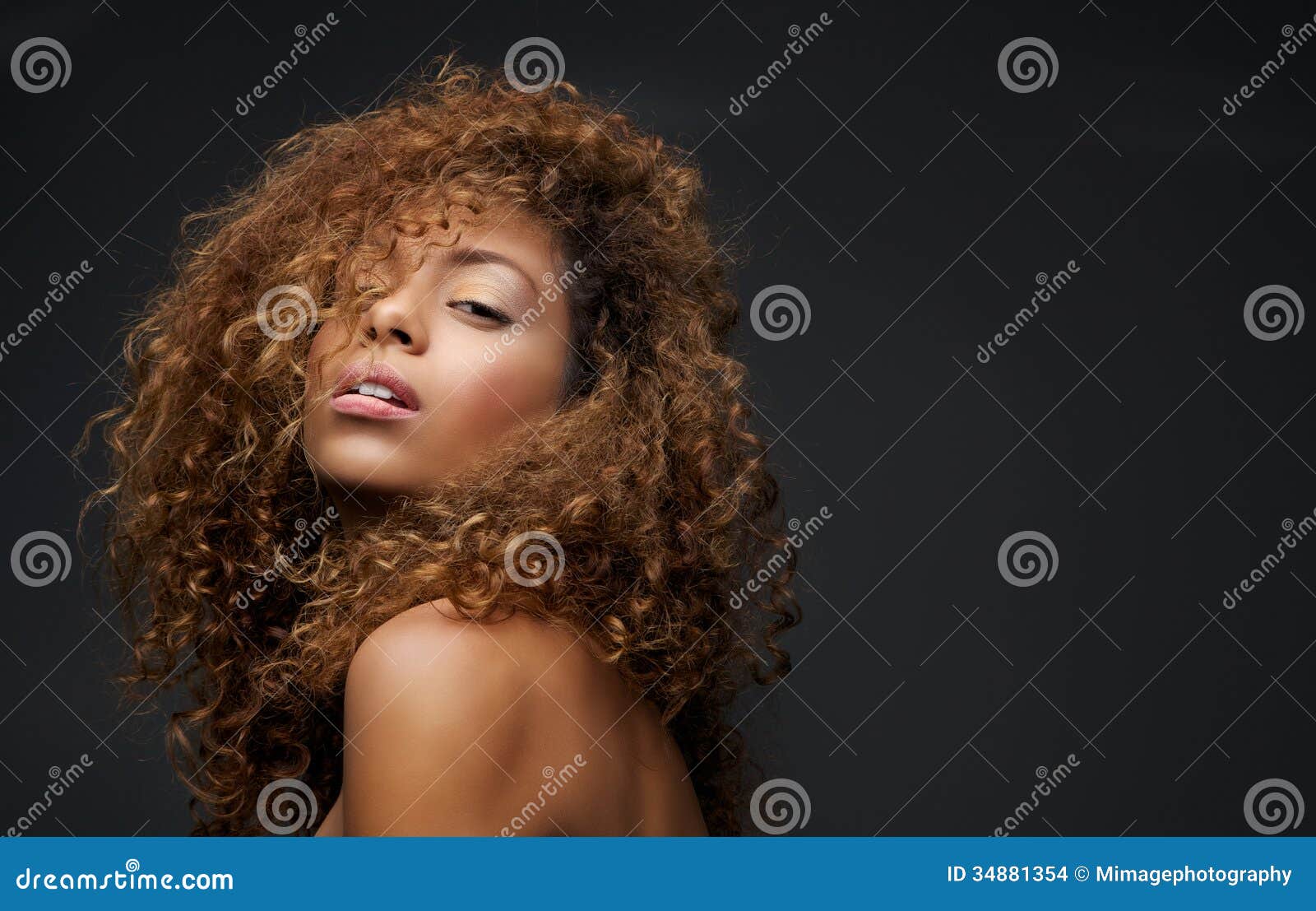 portrait of a beautiful female fashion model with curly hair