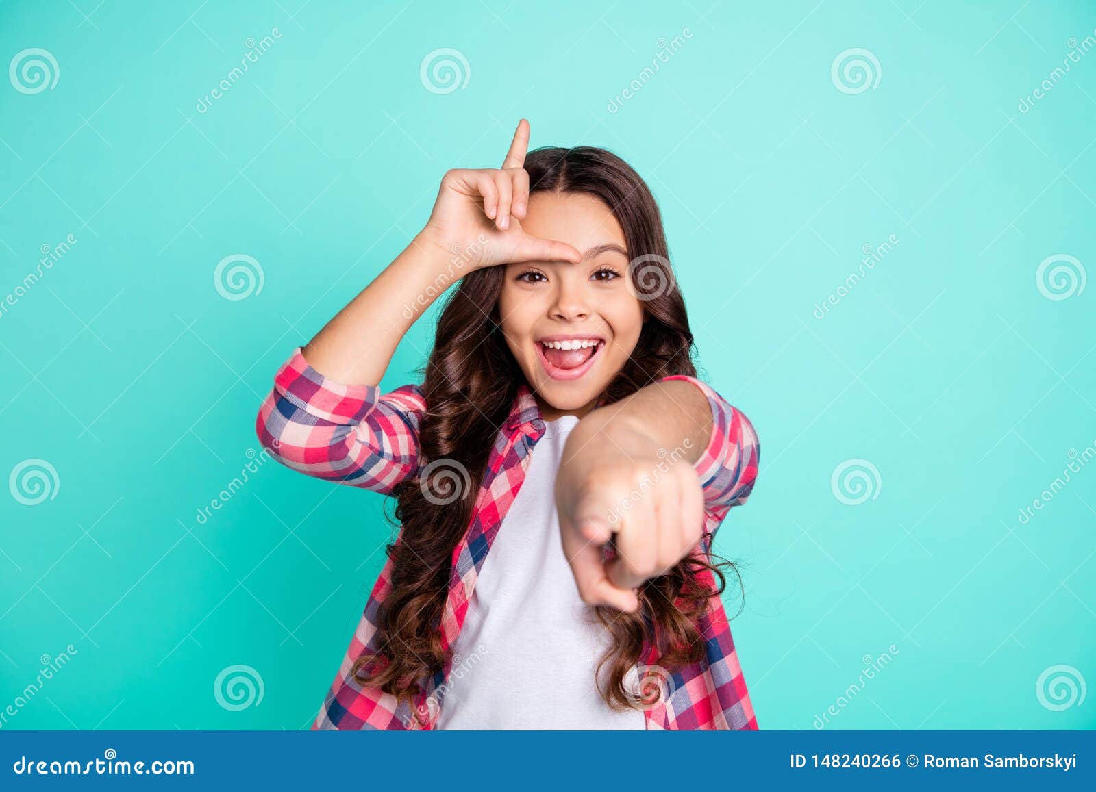 portrait of beautiful funny kid bulling humiliate laughter childish playful excited wavy long hairstyle dressed checked