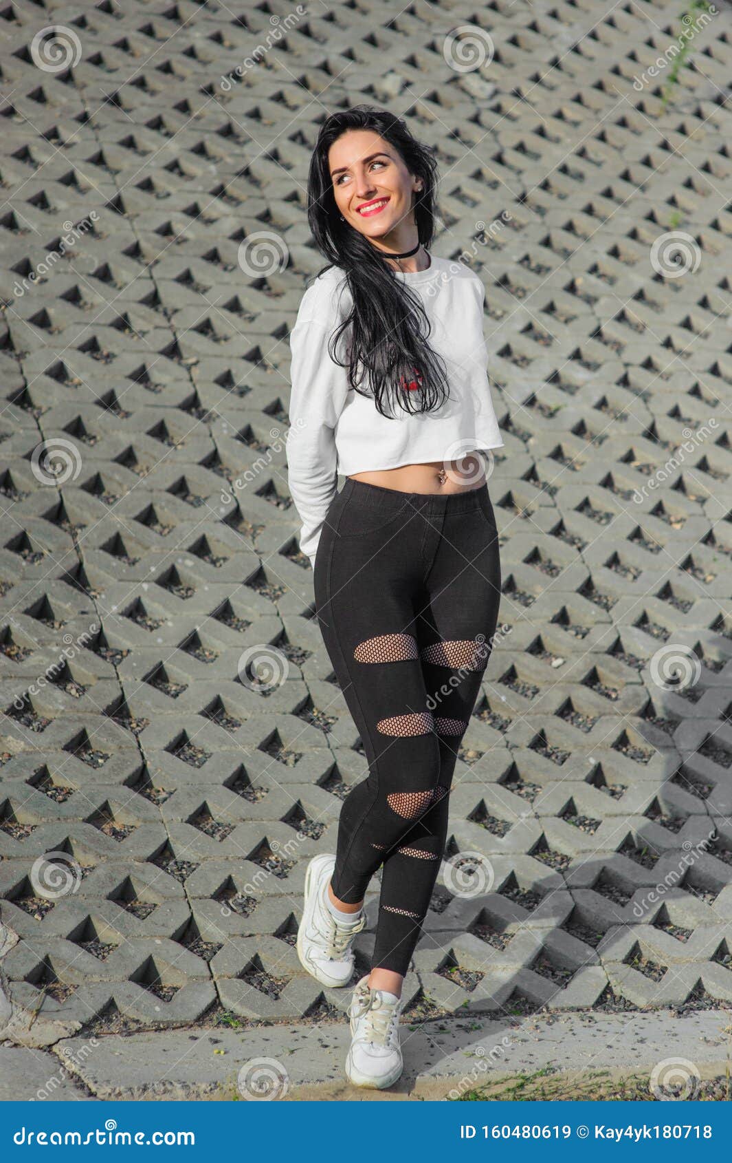 Portrait of a Beautiful Girl with Black Hair. on the Street. on a Gray ...