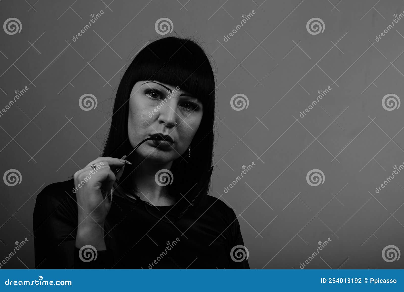 Portrait Of A Beautiful Girl With Glasses Posing For A Photographer In