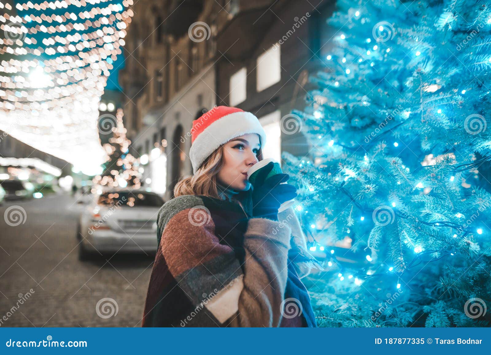 Portrait of a Beautiful Girl in a Hat of Santa Claus Stands on a ...