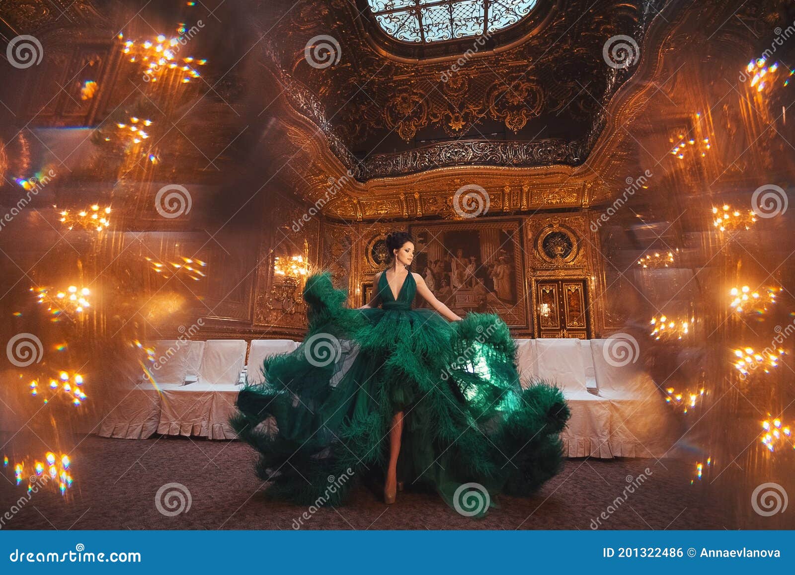 portrait of a beautiful girl in a haute couture green dress.