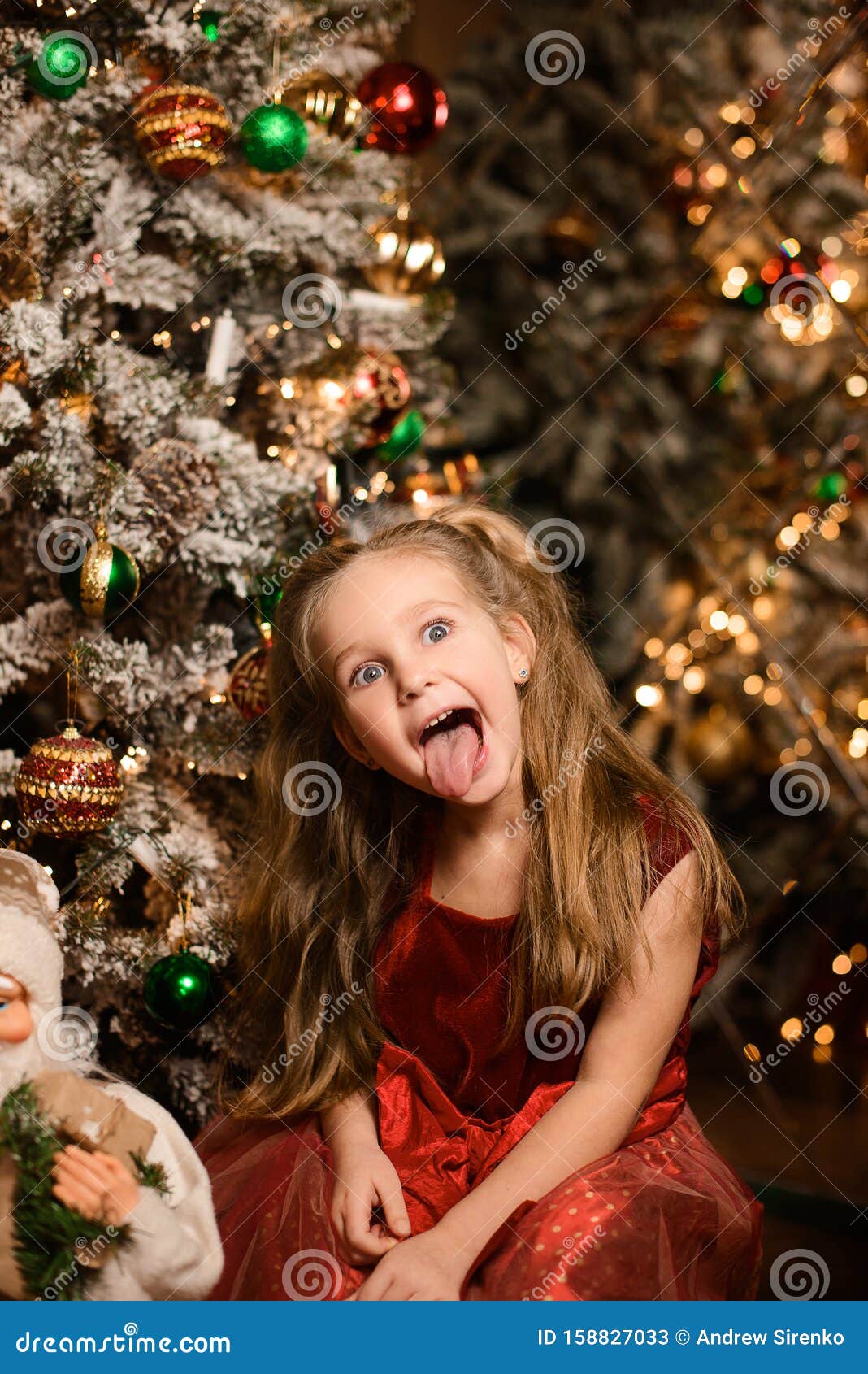 Young Beautiful Smiling Santa Woman Near The Christmas 