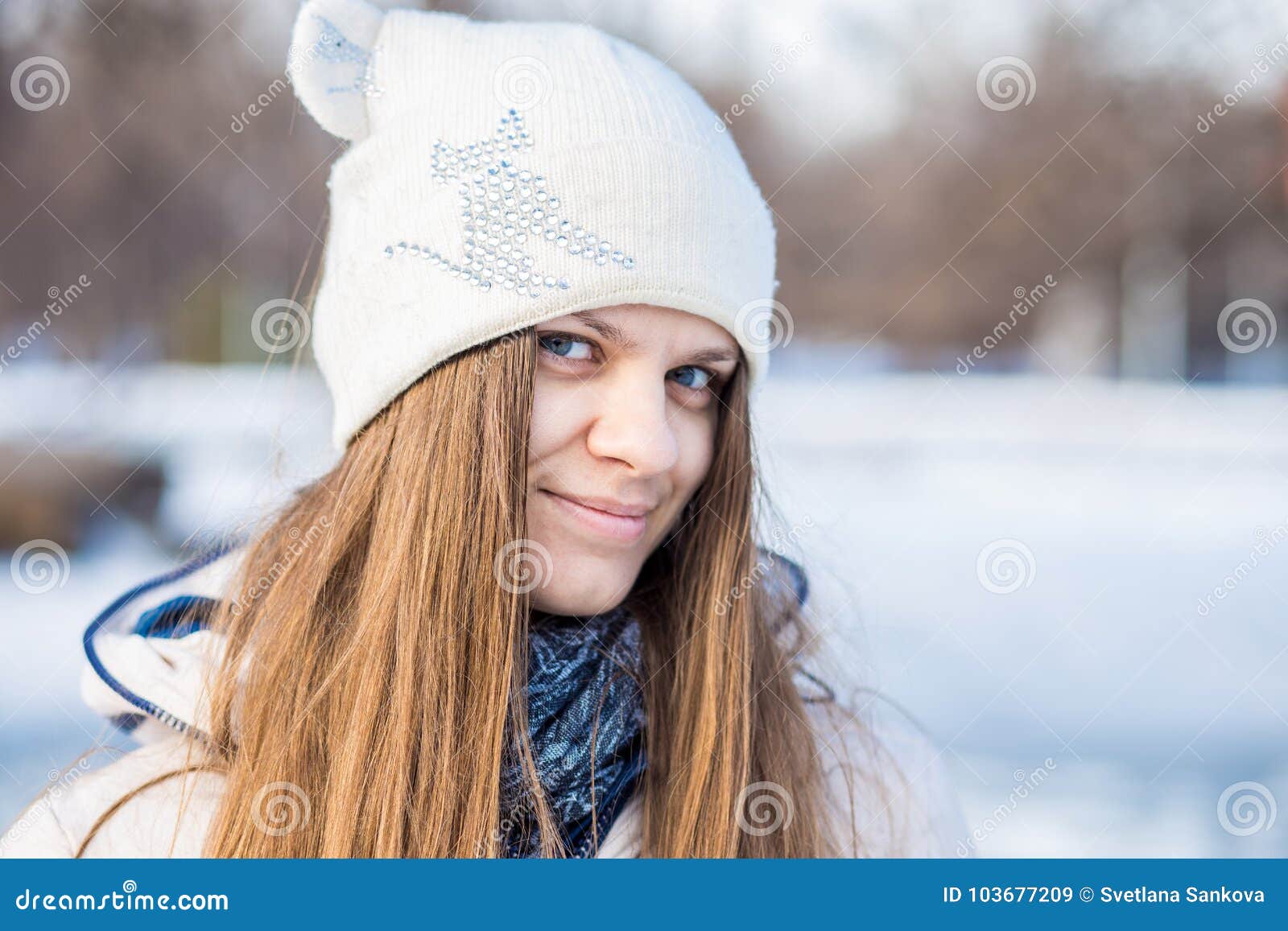 Portrait of a Beautiful Girl in White with Very Long Hair in a Snowy ...