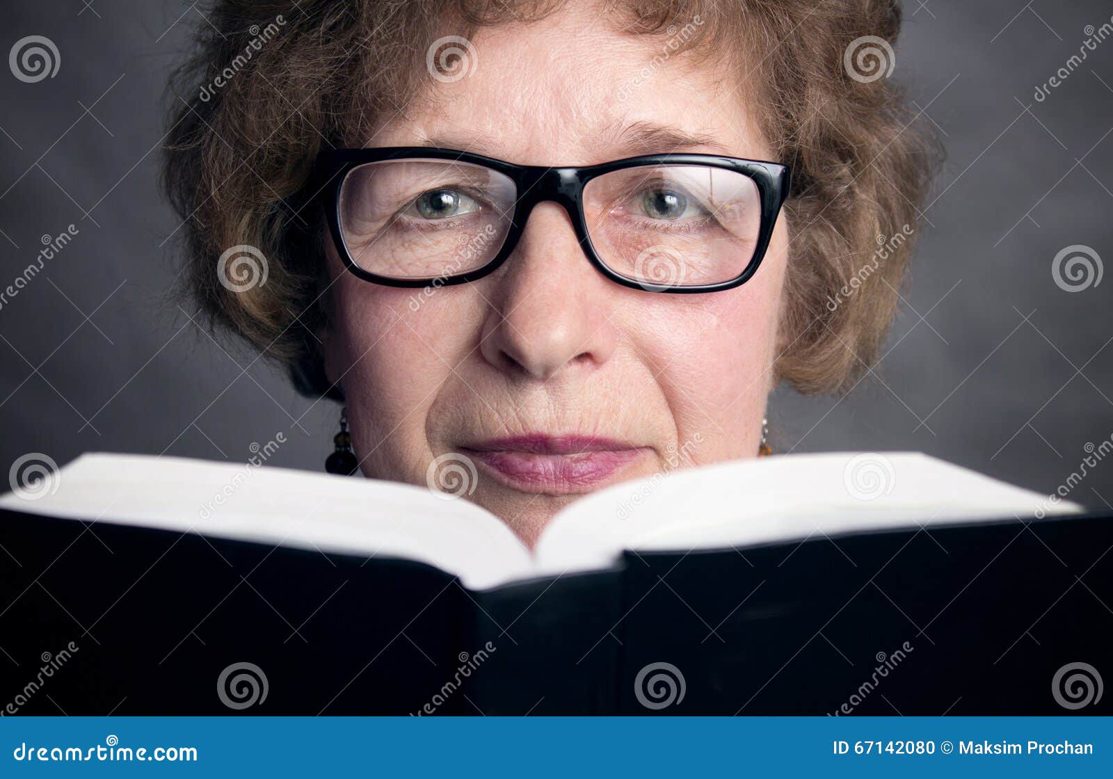 Portrait Of A Beautiful Older Woman With Glasses Stock
