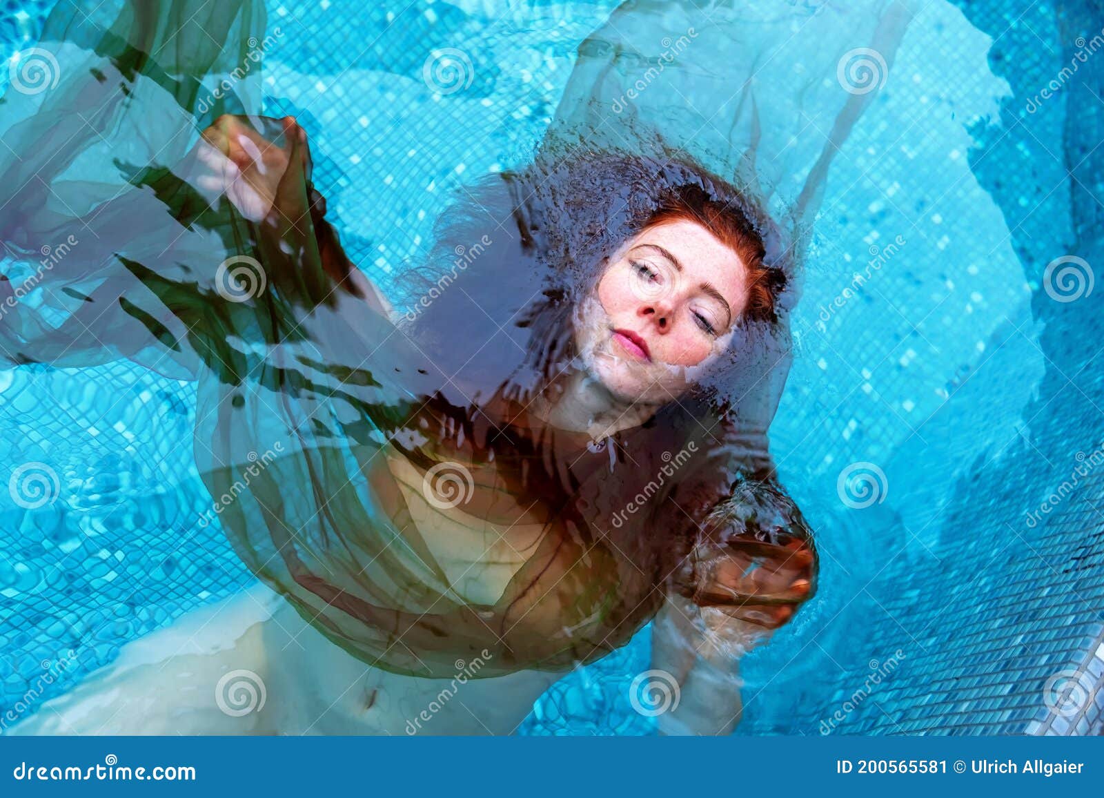 Portrait Of Beautiful Young Red Haired Woman Ginger Redhead Happily Floating In Turquoise Blue 