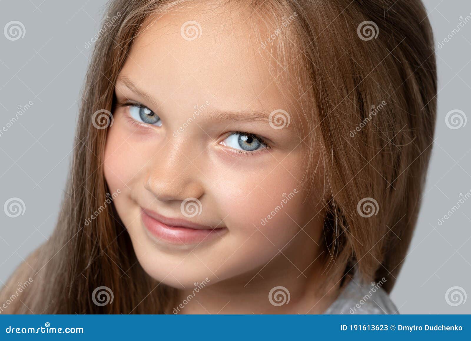 Portrait of a Beautiful Smiling Girl with Blue Eyes, with Light Brown Hair.  she Looks into the Camera Stock Image - Image of beautiful, daughter:  191613623