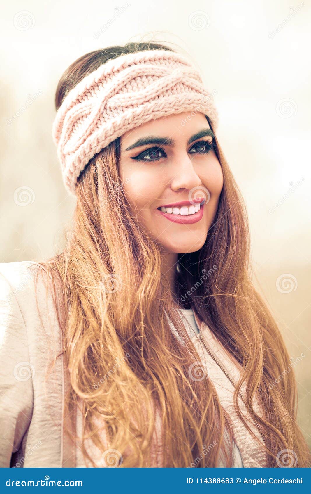 Portrait of a Beautiful and Smiling Woman with Pink Headband and Long ...