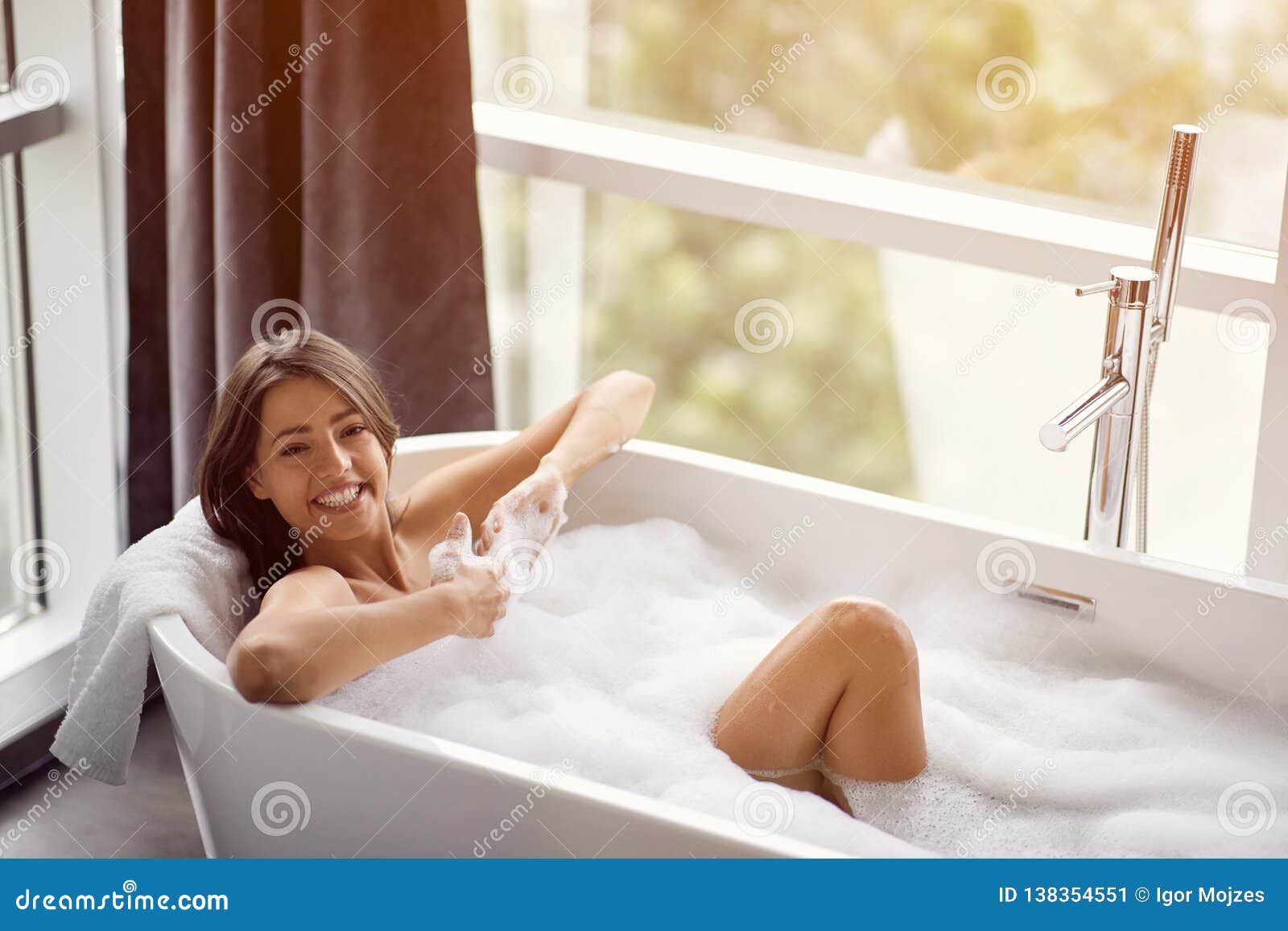 Portrait Of Beautiful Woman Relaxing In Bath With Foam Stock Image