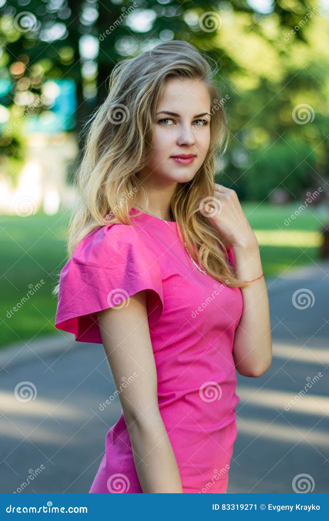 Portrait of a Beautiful Smiling Young Cute Girl in a Pink Summer Dress ...