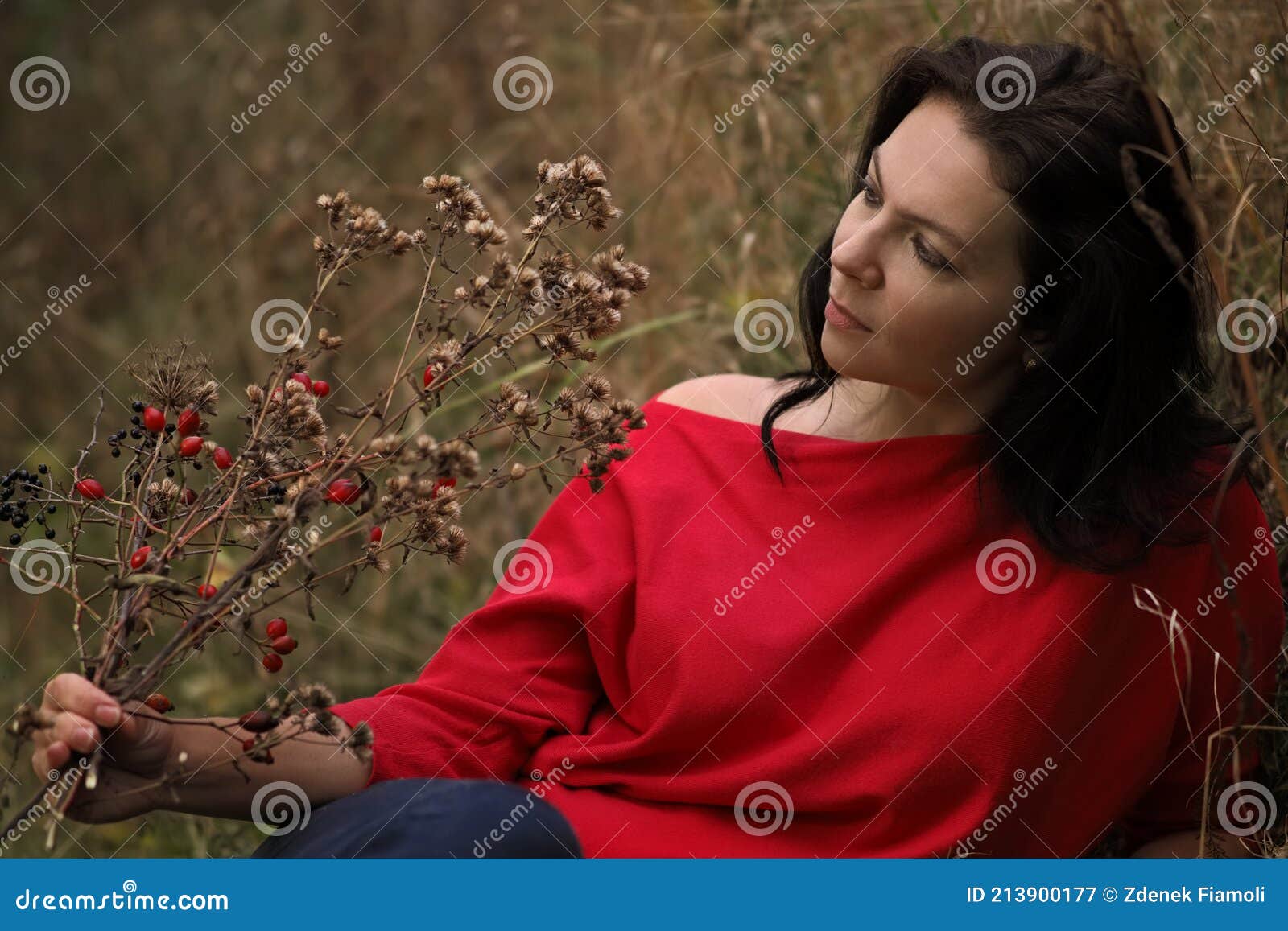 beautiful thirty year old woman relaxes in the autumn park