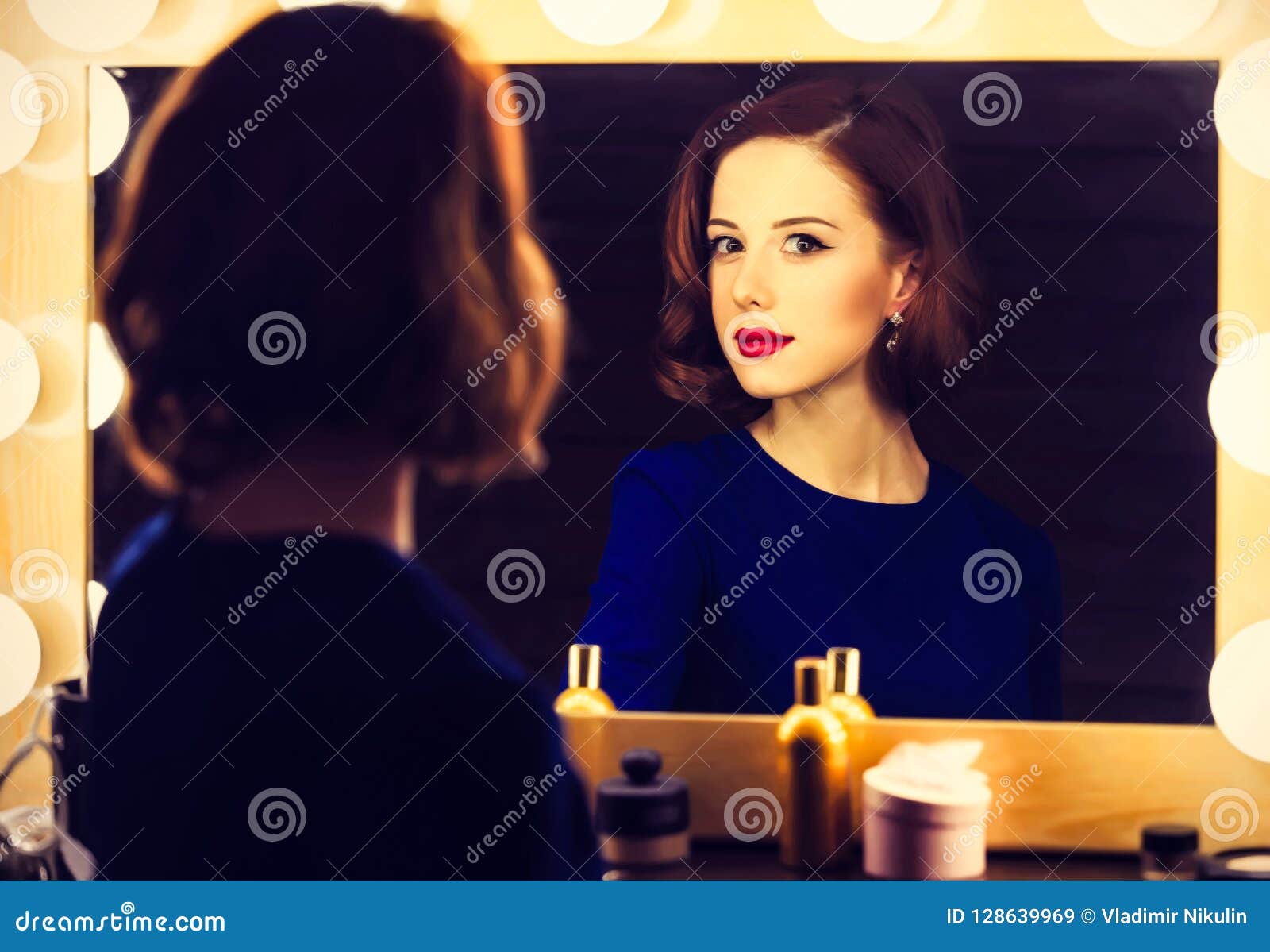 Portrait Of A Beautiful Woman As Applying Makeup Near A ...