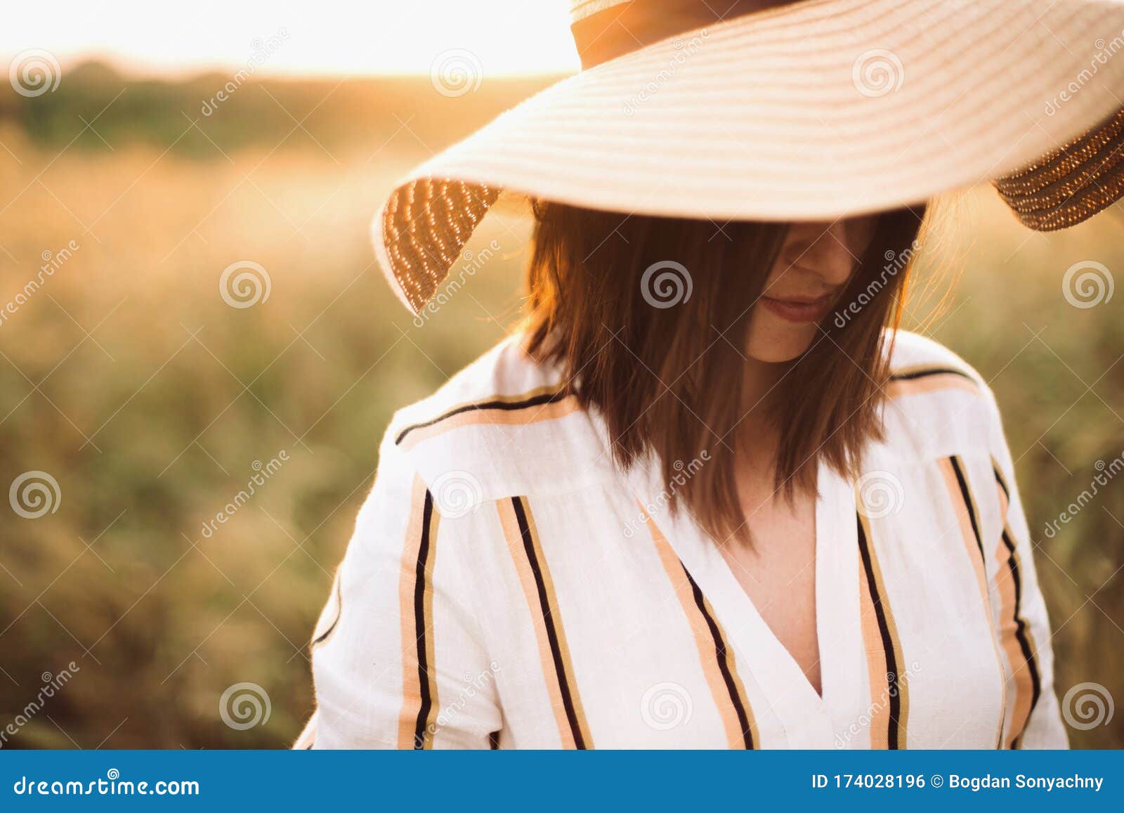 Portrait of Beautiful Woman in Hat Enjoying Sunset Golden Light in ...