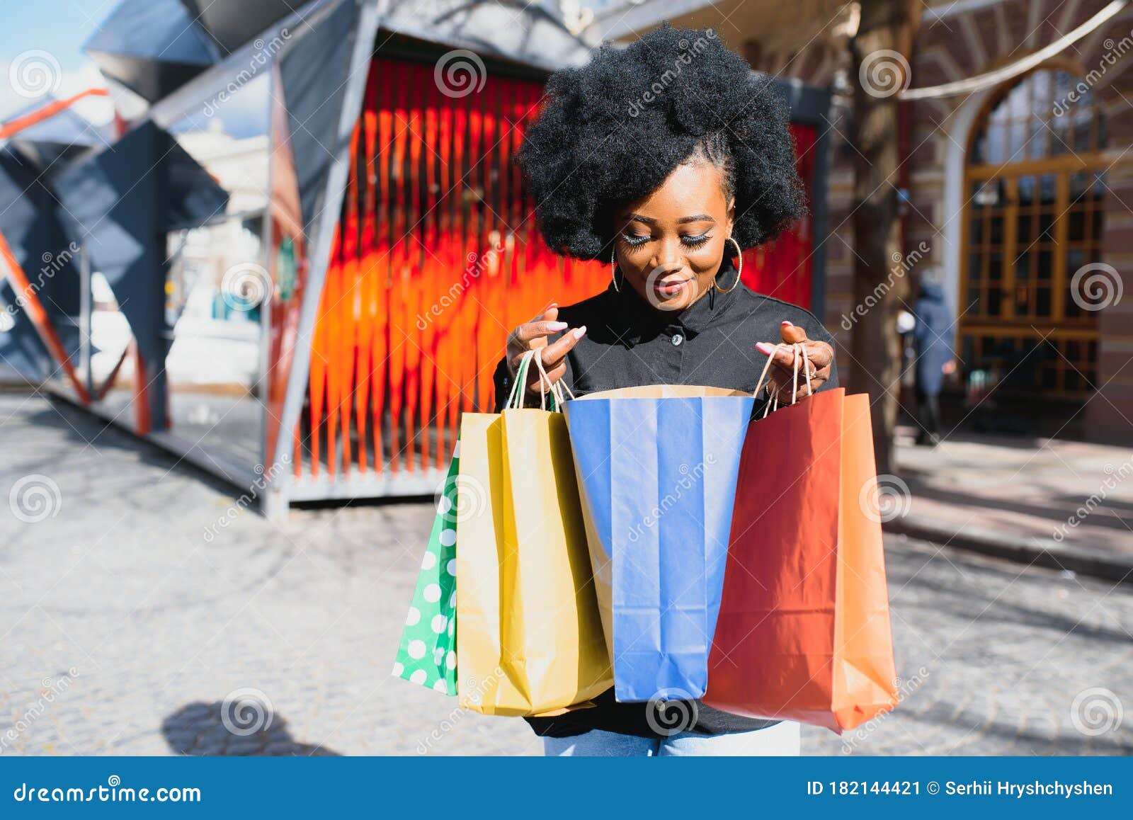 Portrait of Beautiful Young Black Woman Smiling with Shopping Bags ...