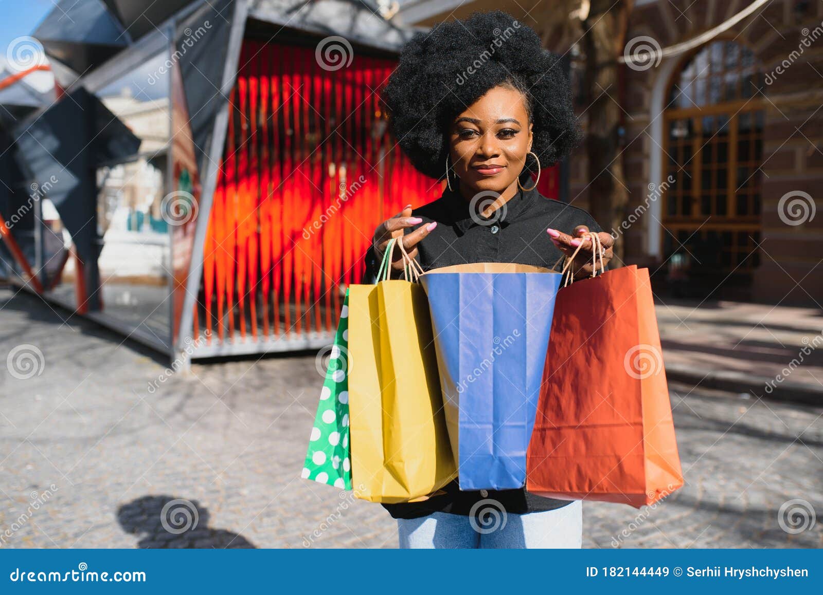 Portrait of Beautiful Young Black Woman Smiling with Shopping Bags ...