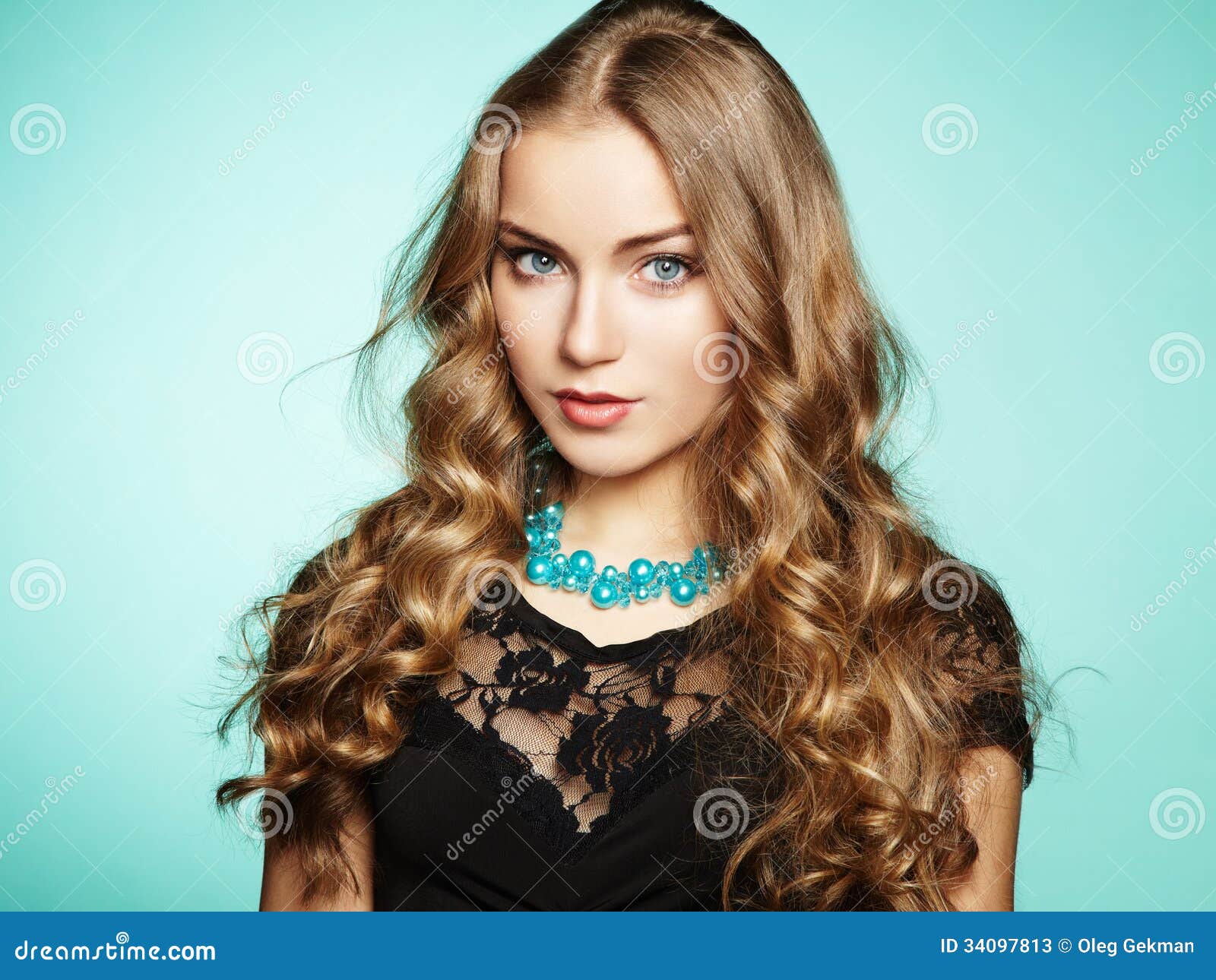 portrait of beautiful young blonde girl in black dress