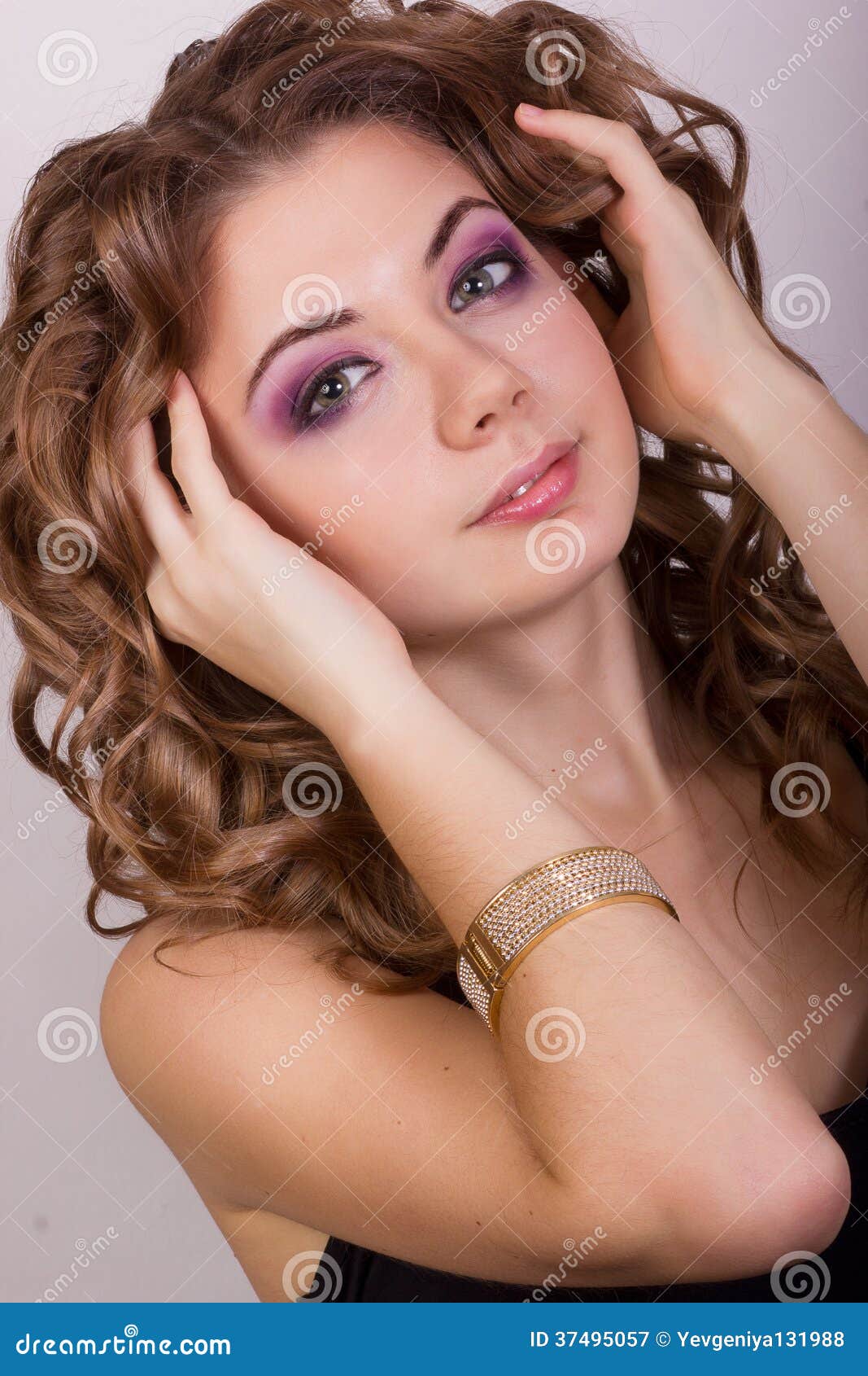 Portrait Of A Beautiful Young Girl With Brown Curly Hair 