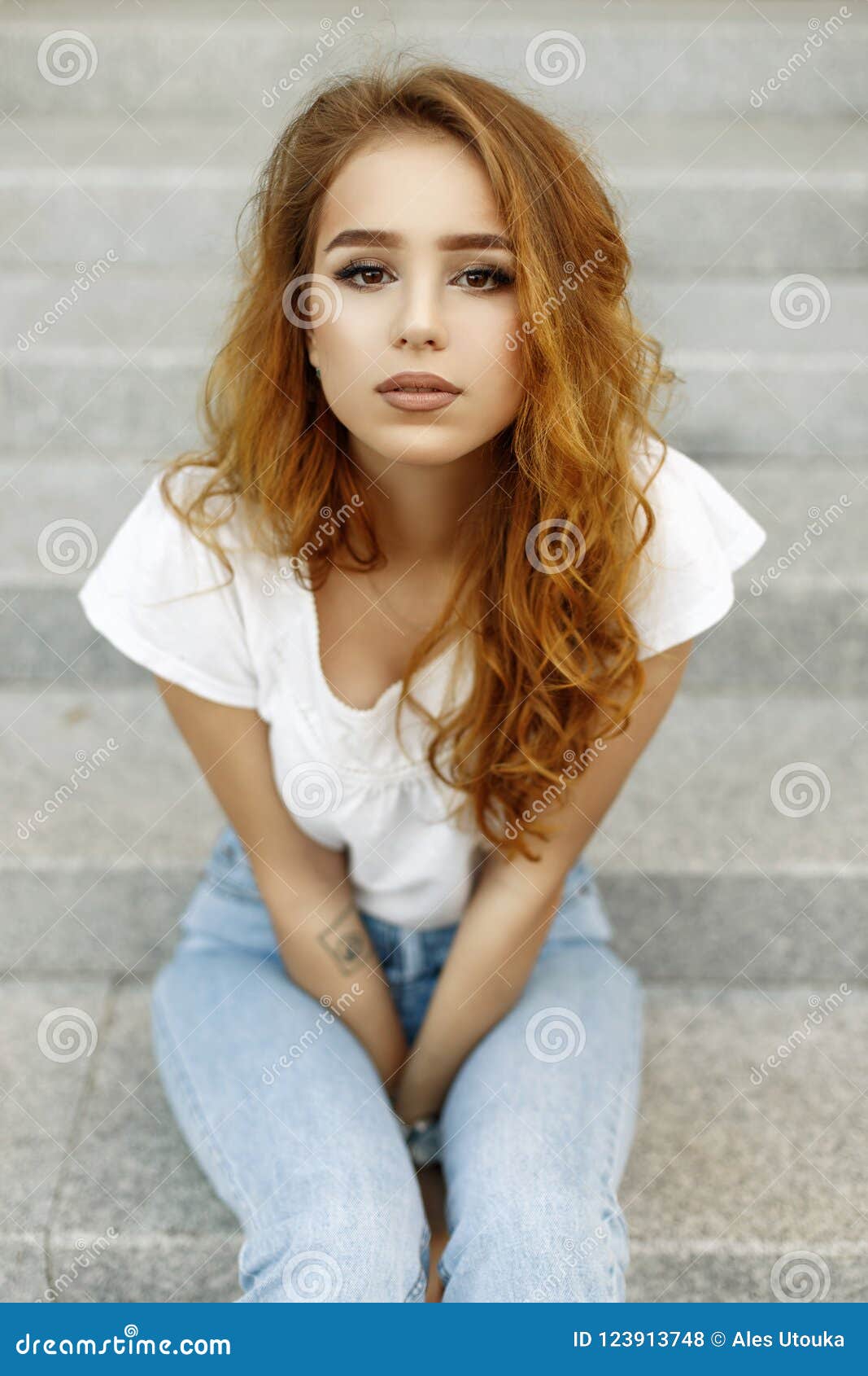 Portrait Of A Beautiful Young Girl With Brown Eyes And Red Stock