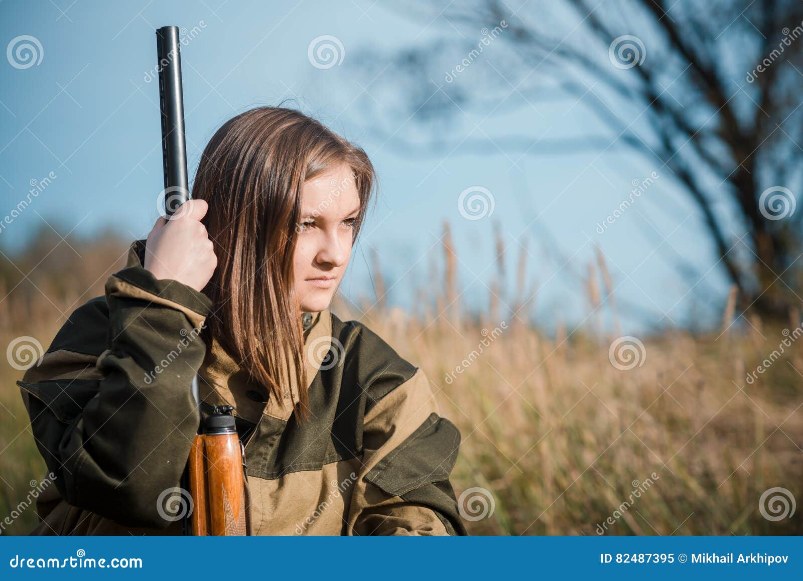 Portrait of a Beautiful Young Girl in Camouflage Hunter with Shotgun ...