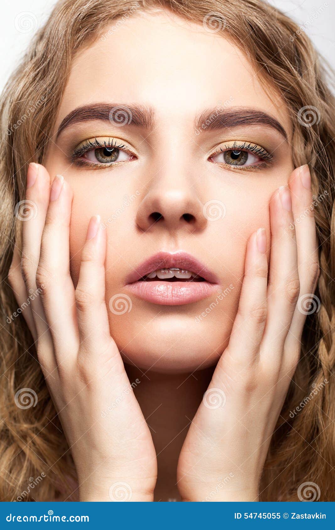 Portrait Of Beautiful Young Girl With Hands On The Face. Stock Photo