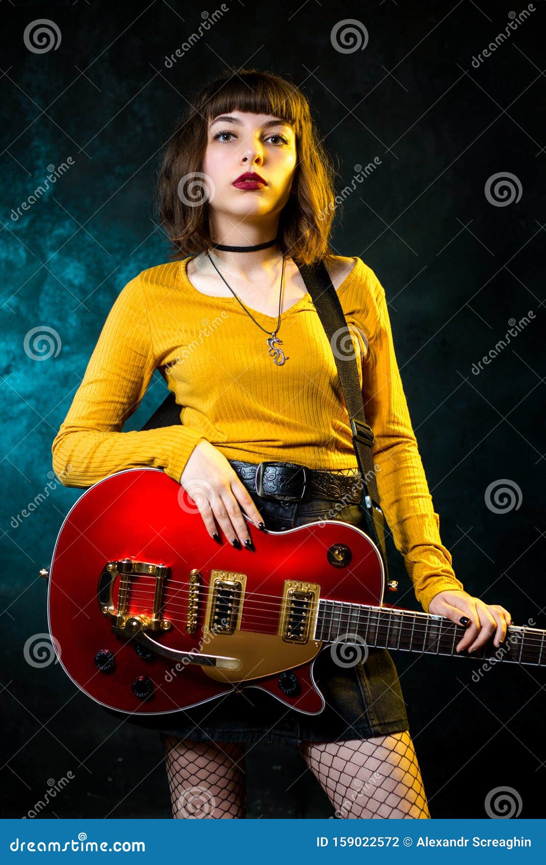 Portrait of Beautiful Young Hipster Woman with Curly Hair with Red Guitar  in Neon Lights. Rock Musician is Playing Stock Photo - Image of colorful,  expression: 159022572