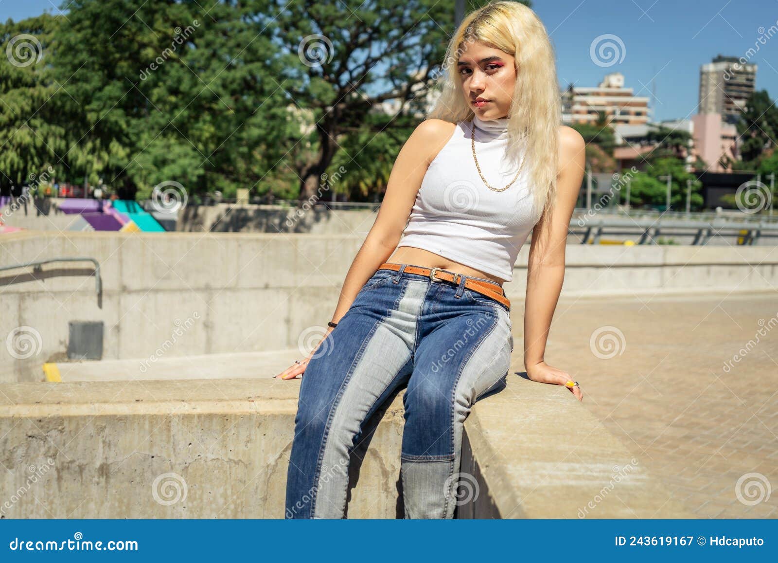 Portrait of a Beautiful Young Latina Woman in a White T-shirt Sitting ...