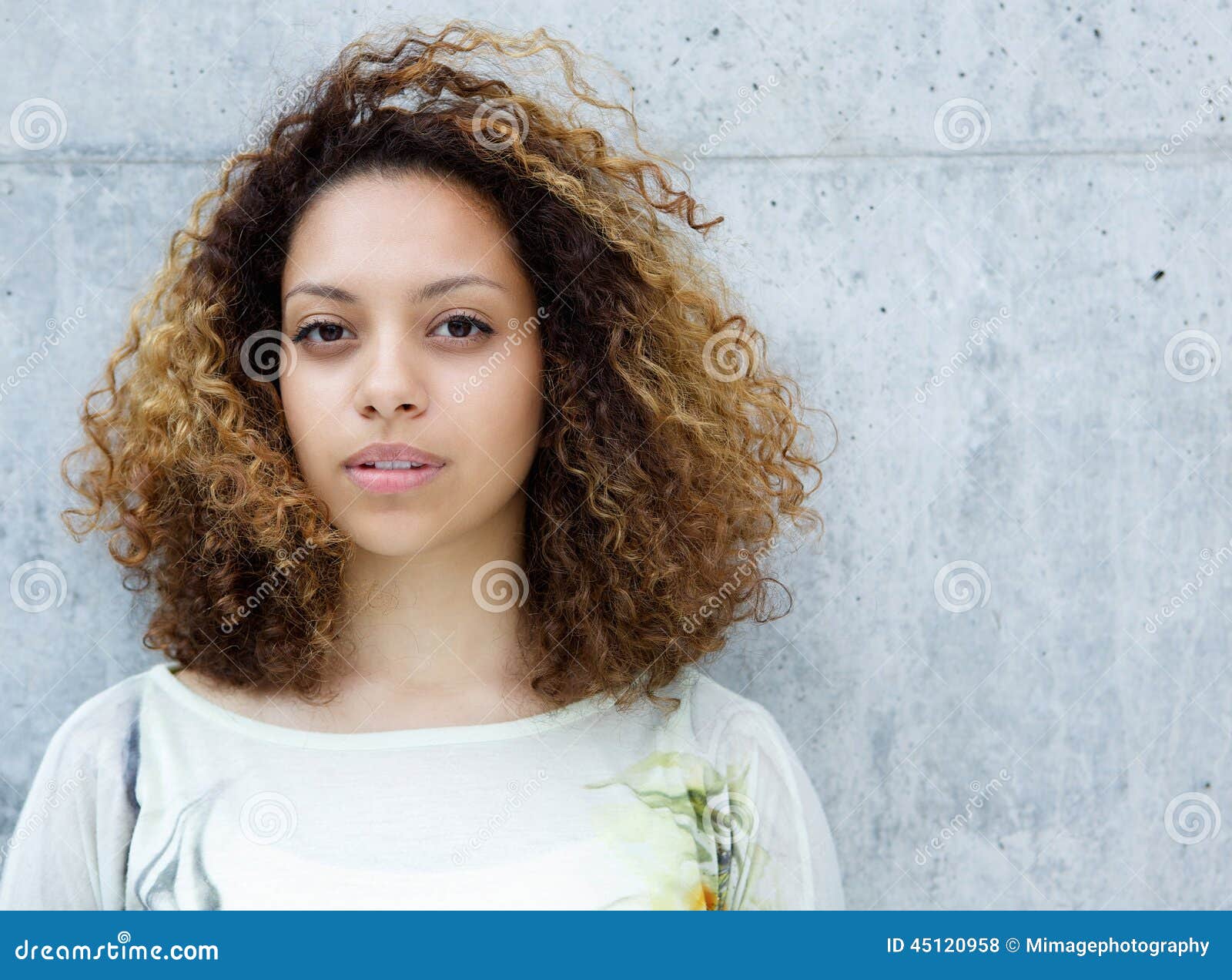 portrait-beautiful-young-mixed-race-woman-close-up-posing-against-gray-background-45120958.jpg