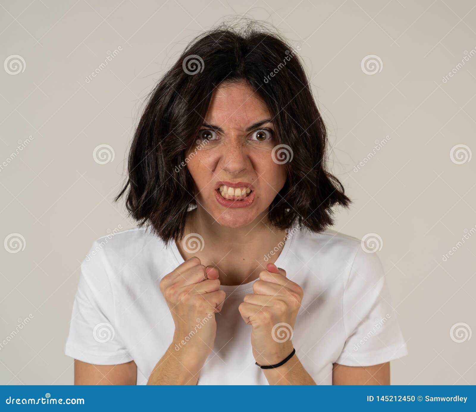 Portrait Of A Beautiful Young Woman With Angry Face Looking Furious 