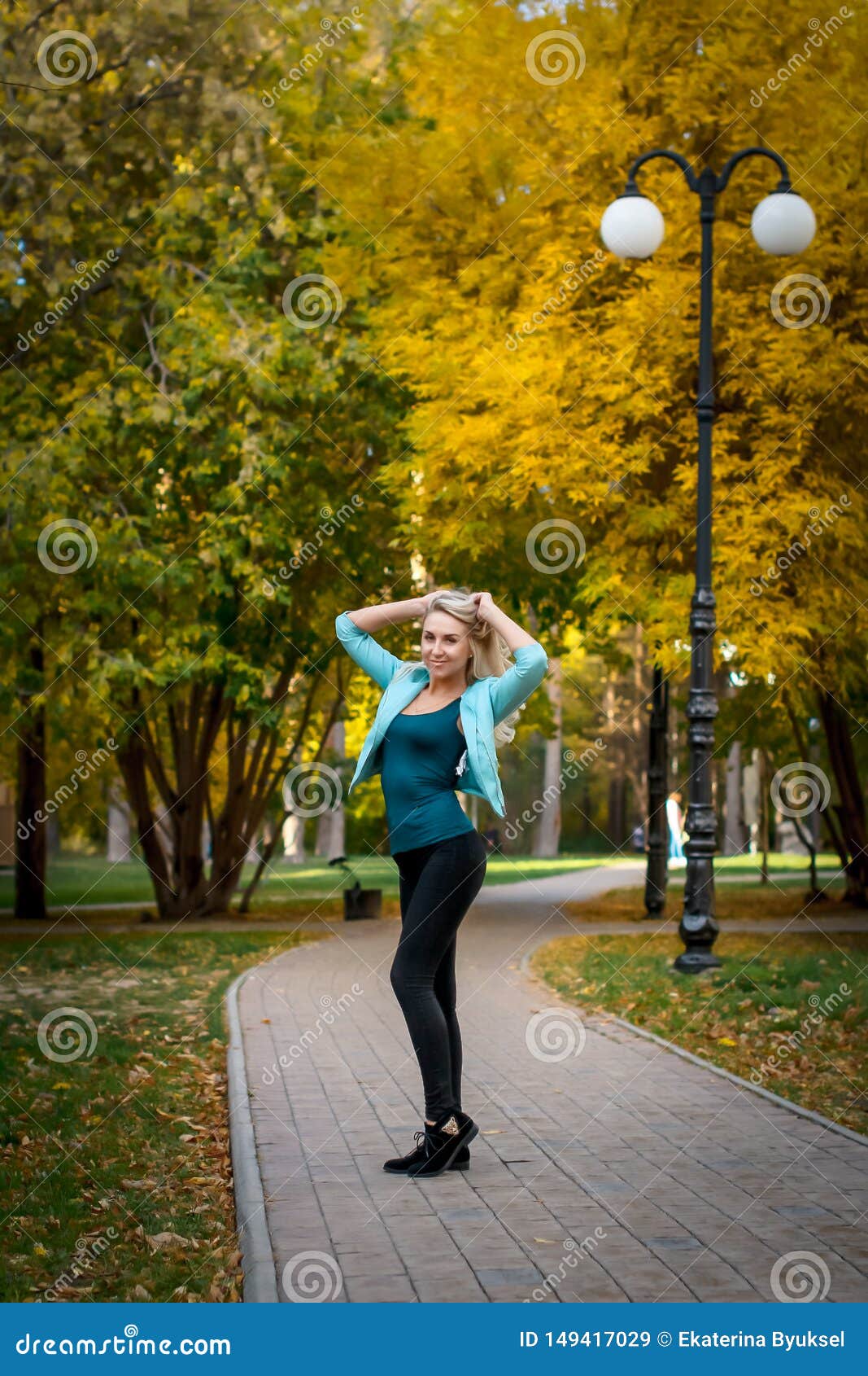 Portrait of a Beautiful Young Woman Enjoying Autumn in the Park ...