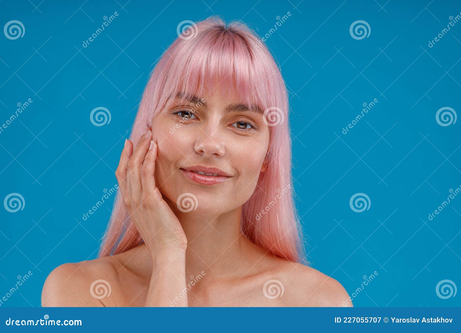 Portrait Of Beautiful Young Woman With Pink Hair And Perfect Skin Looking At Camera Posing 