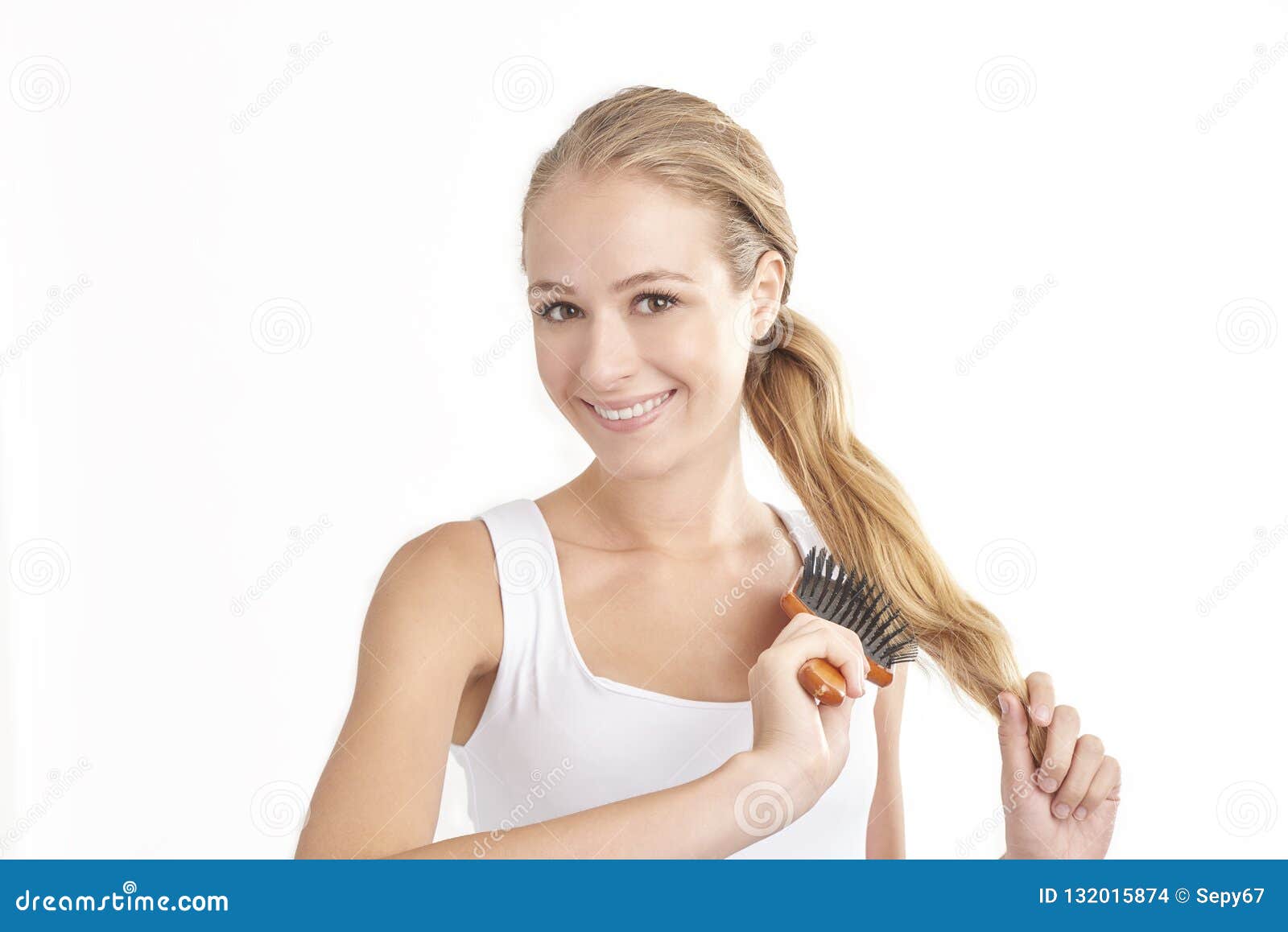 Woman Brushing Her Ponytail Stock Photo - Image Of Person, Close: 132015874