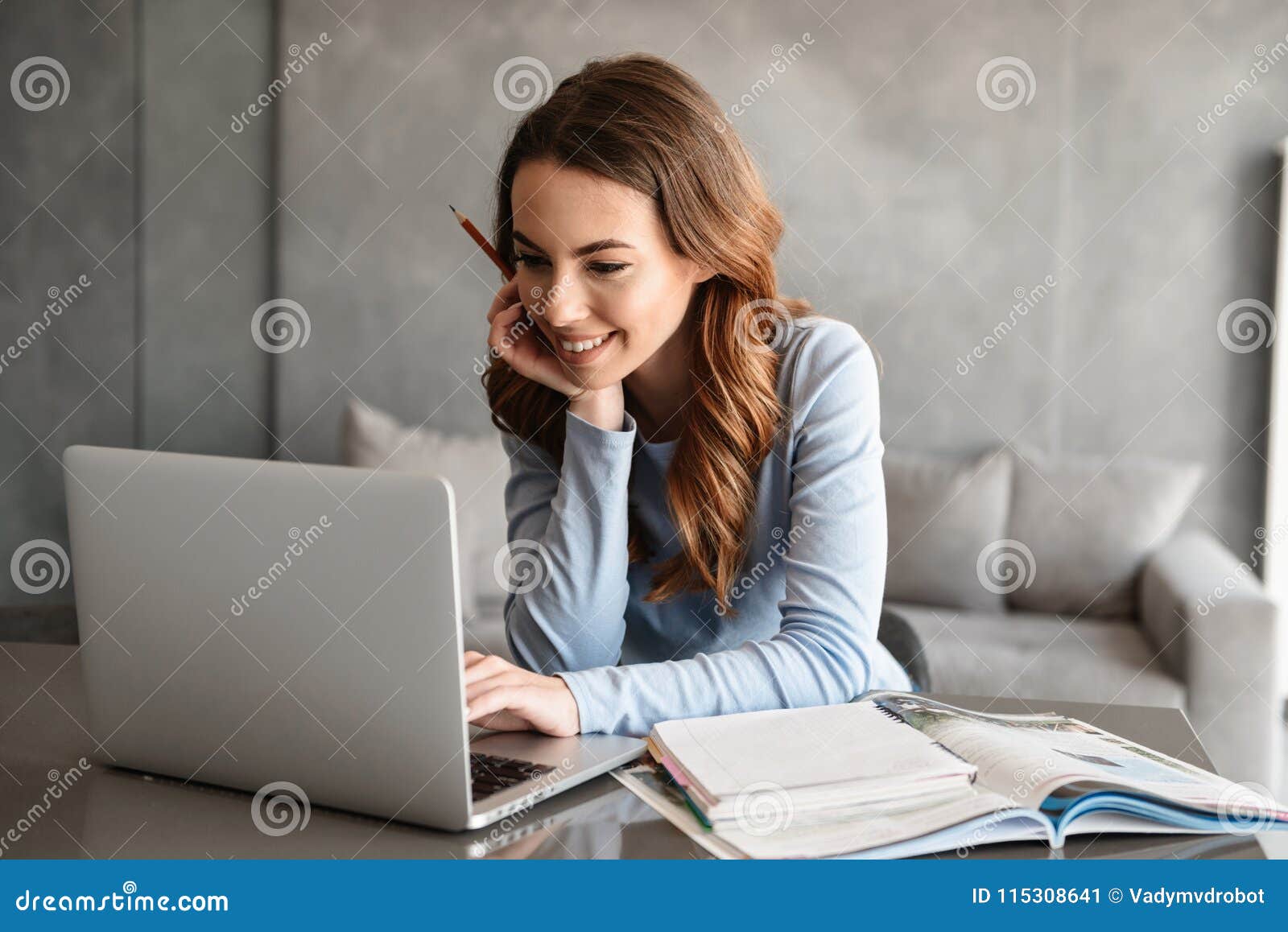 portrait of a beautiful young woman studying