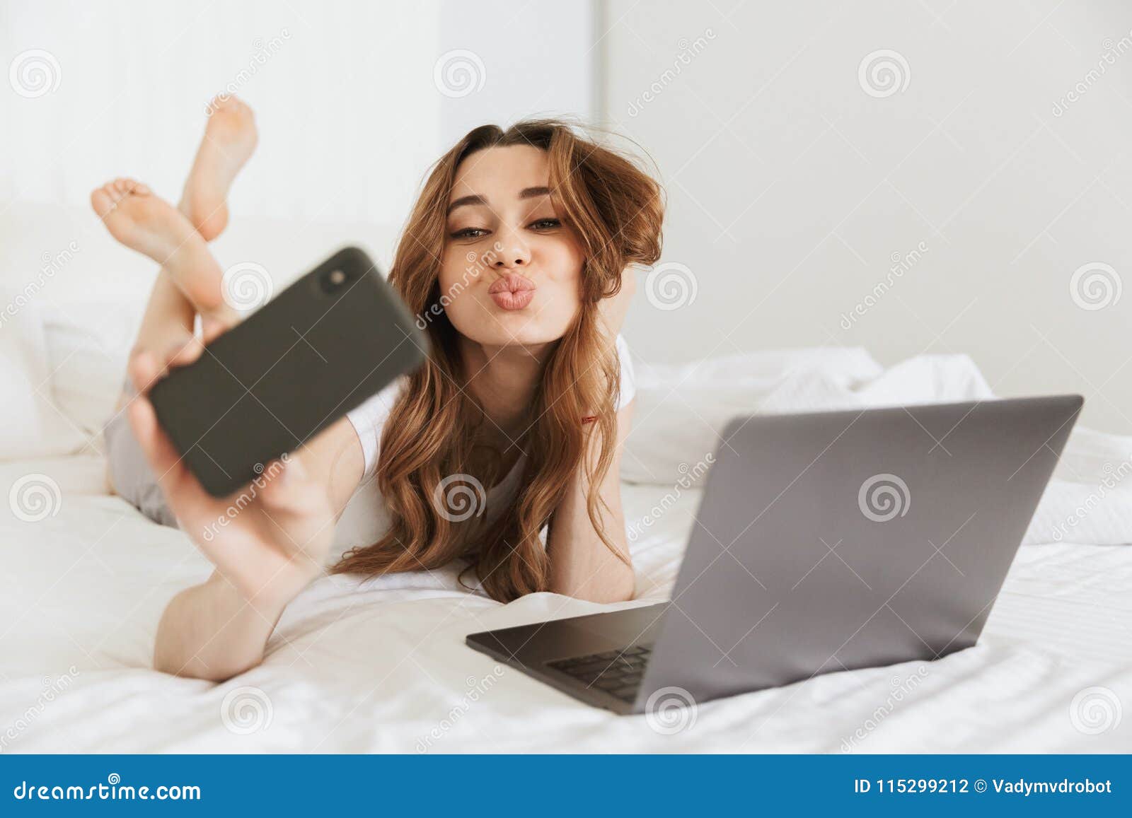 Portrait of a Beautiful Young Woman Taking Selfie Stock Photo - Image