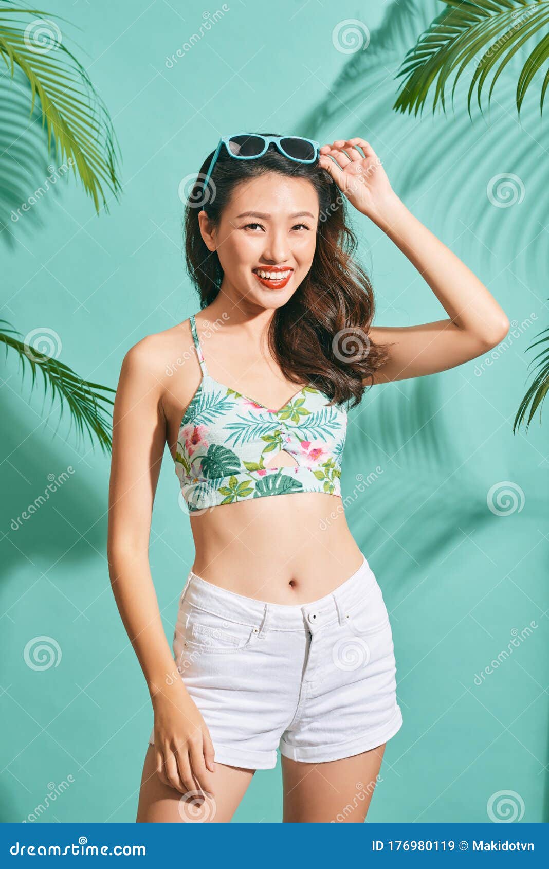 Oriental with biggest bumpers posing in shirt and bikini
