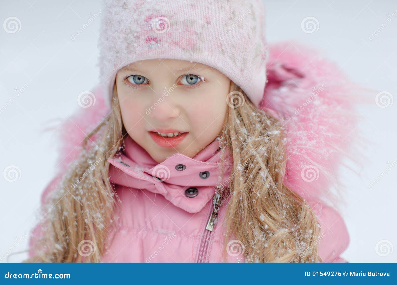 Portrait of a Blonde Girl in a Pink Jacket on a Light Background Stock ...