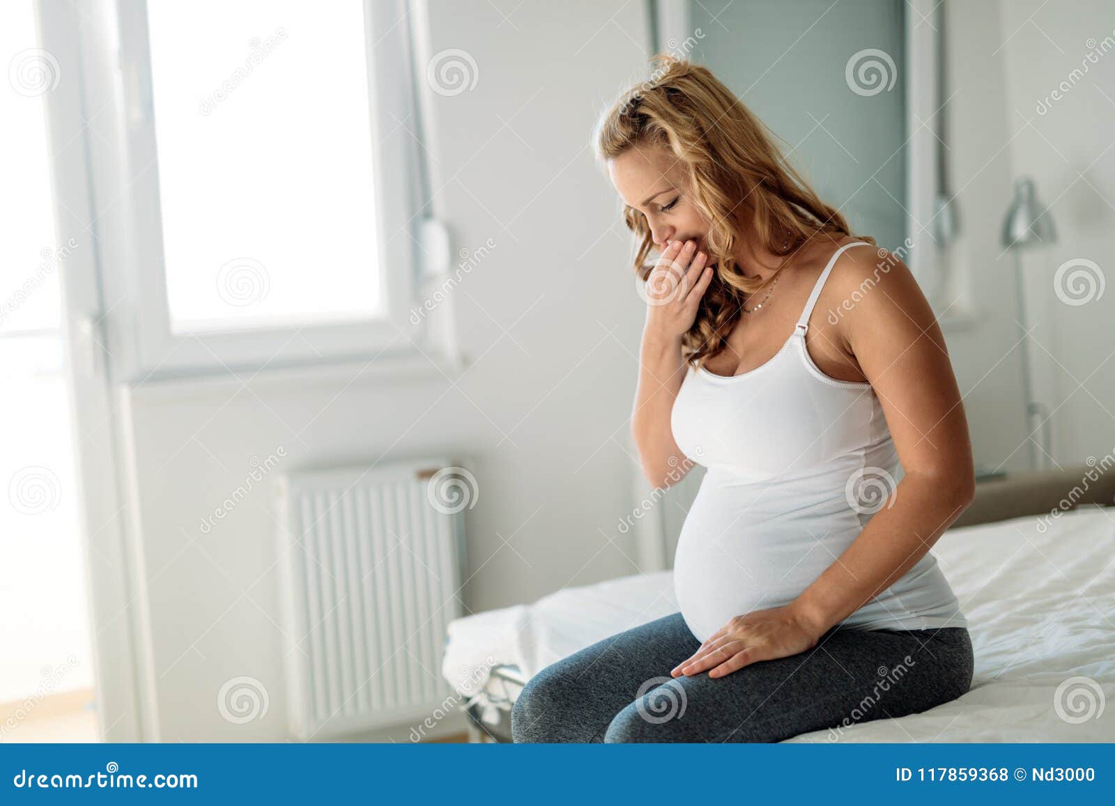 Portrait of Blonde Pregnant Woman Feeling Sick Stock Photo - Image ...