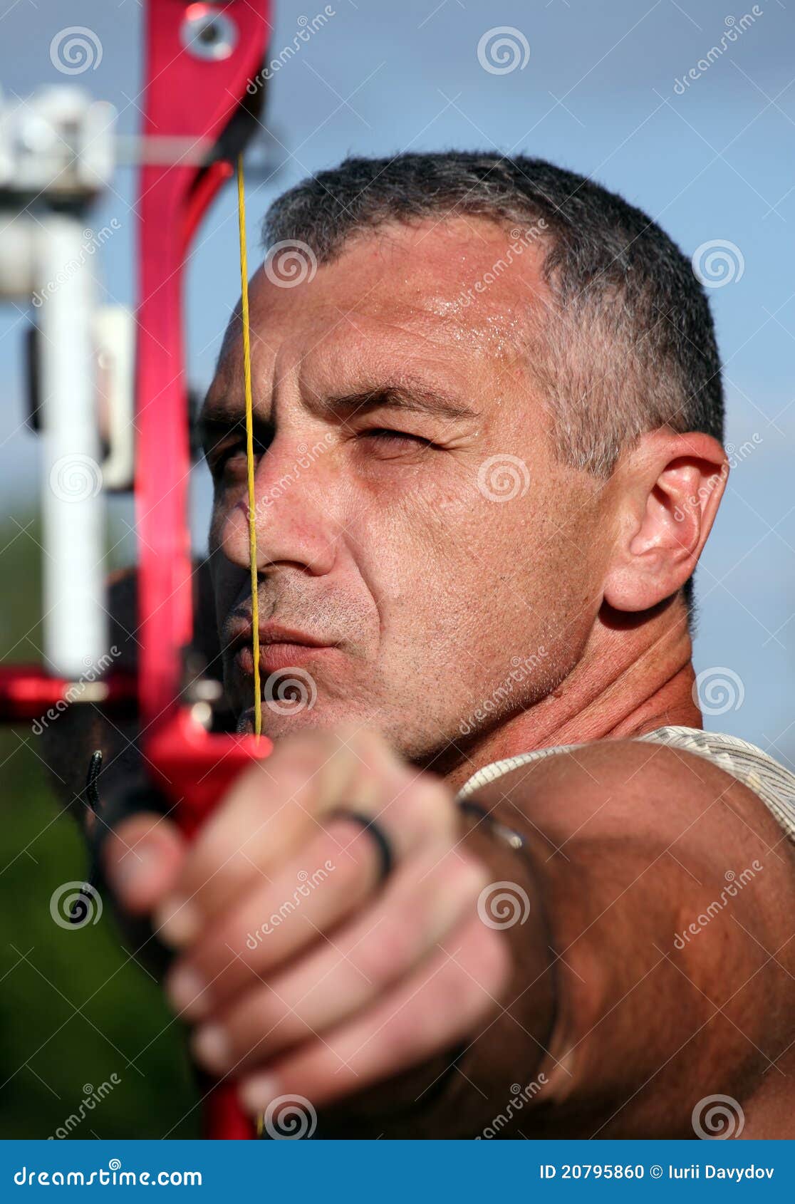 portrait of bowman aiming with bow and arrow